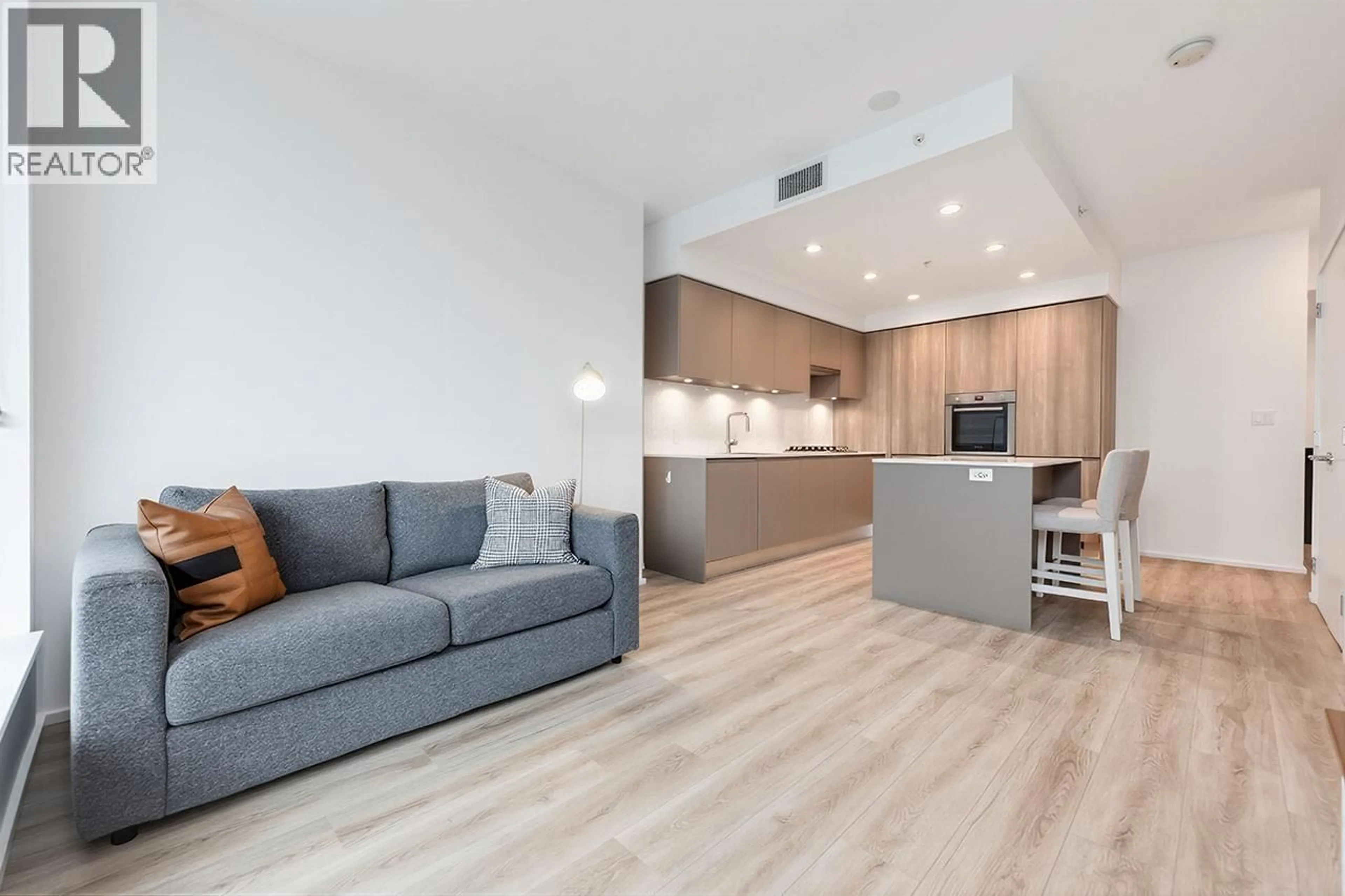 Living room with furniture, wood/laminate floor for 3211 - 3833 EVERGREEN PLACE, Burnaby British Columbia V3J0M2