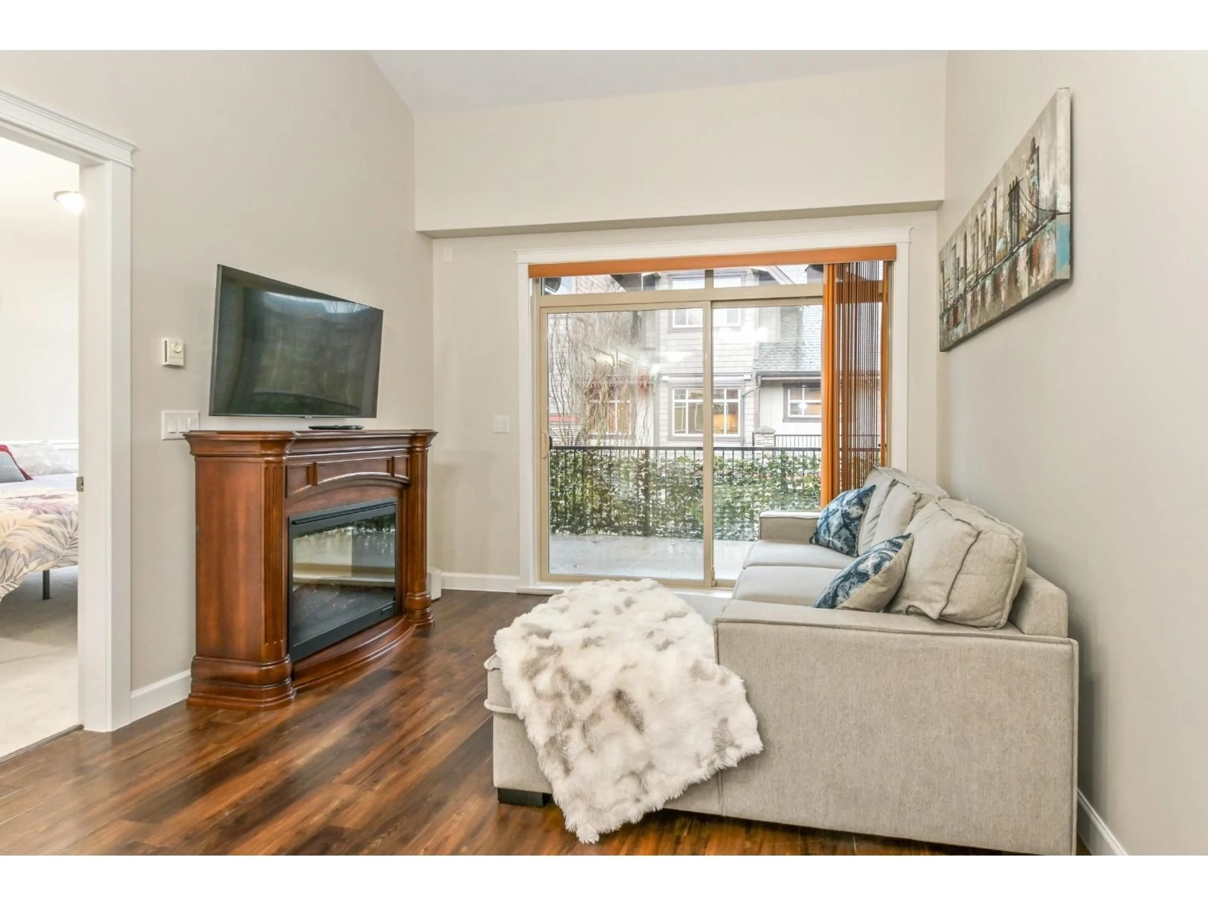 Living room with furniture, wood/laminate floor for 406 - 8328 207A STREET, Langley British Columbia V2Y0K5