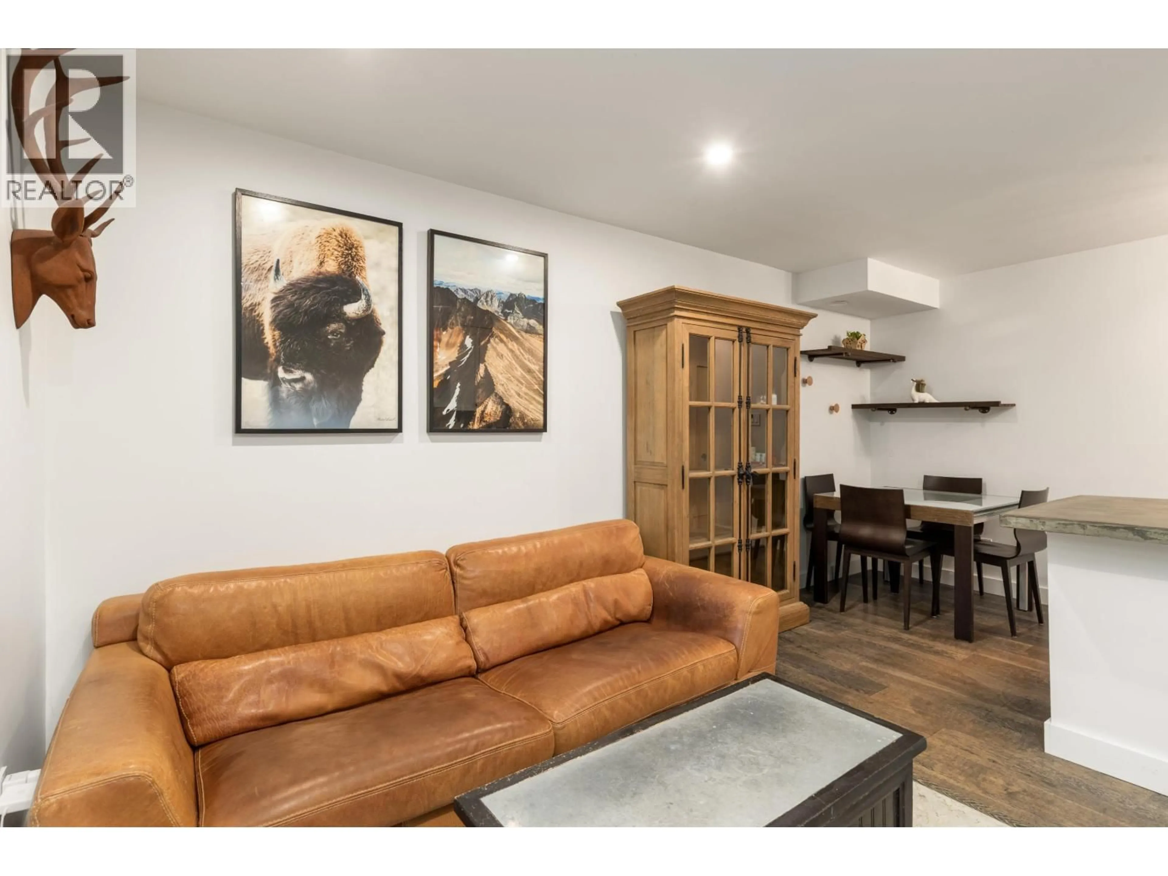 Living room with furniture, wood/laminate floor for 113 - 3070 HILLCREST DRIVE, Whistler British Columbia V8E0V1