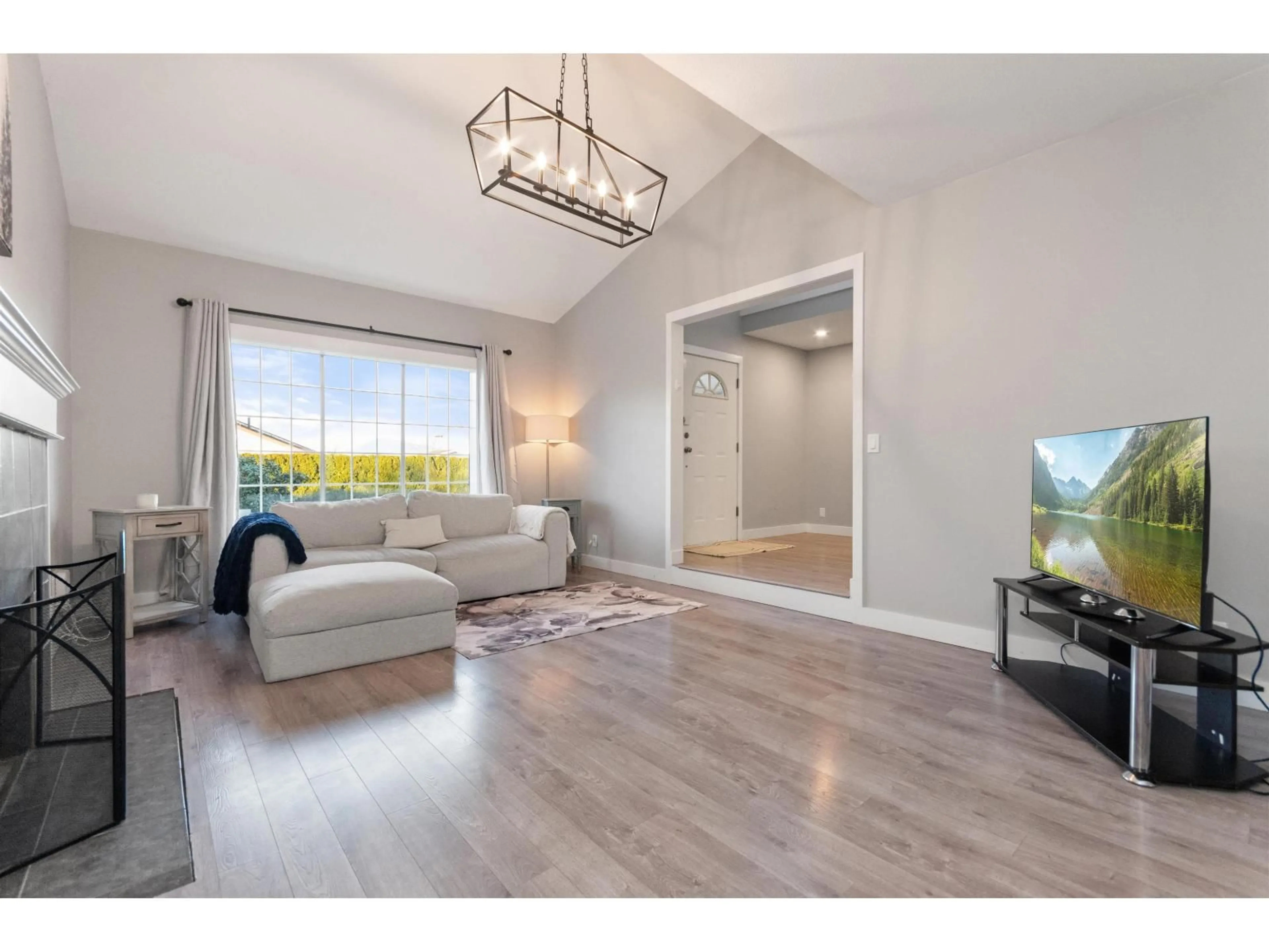 Living room with furniture, wood/laminate floor for 46246 CHRISTINA DRIVE, Chilliwack British Columbia V2R2B6