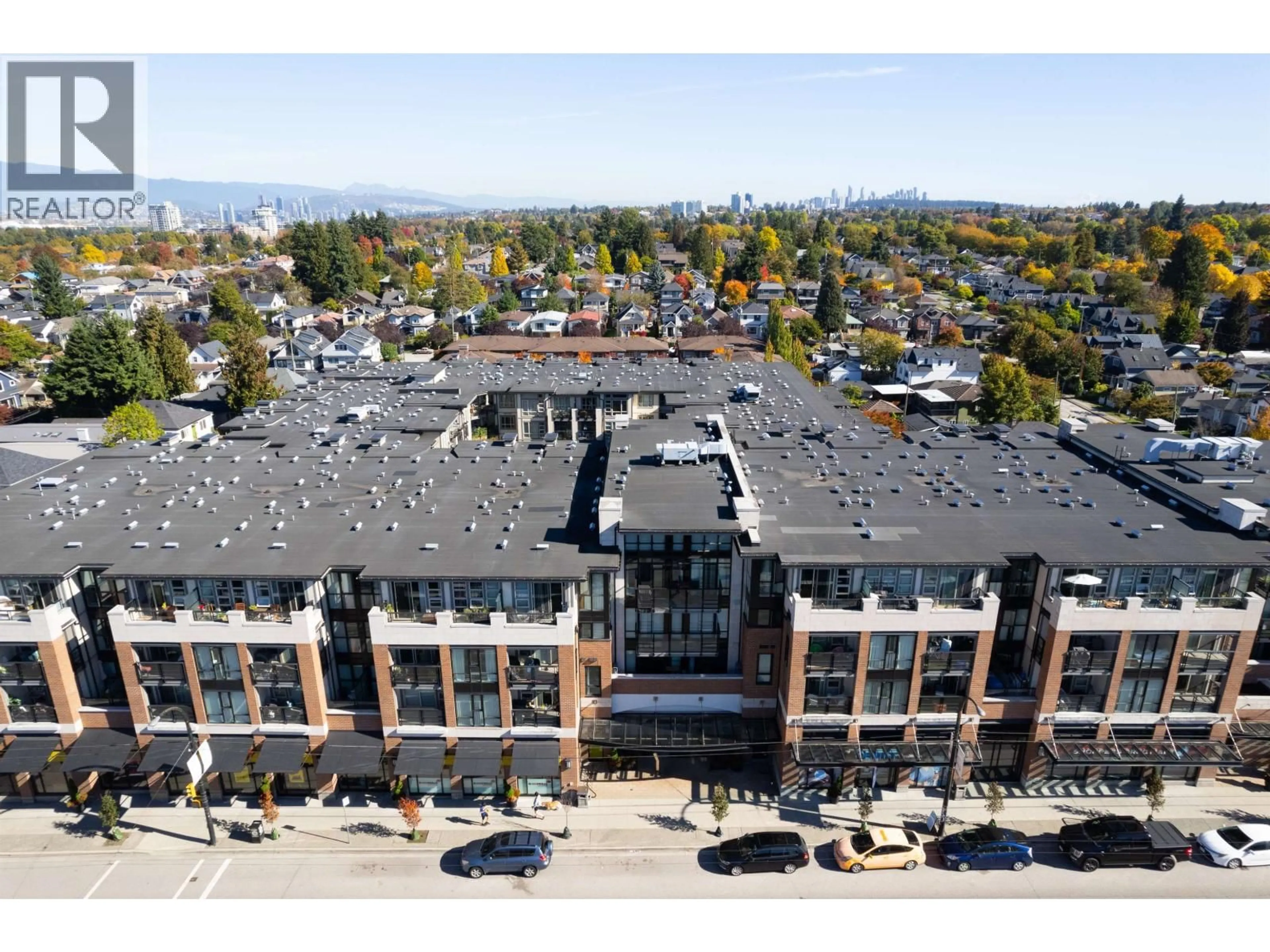 A pic from outside/outdoor area/front of a property/back of a property/a pic from drone, building for 206 - 4550 FRASER STREET, Vancouver British Columbia V5V4G8