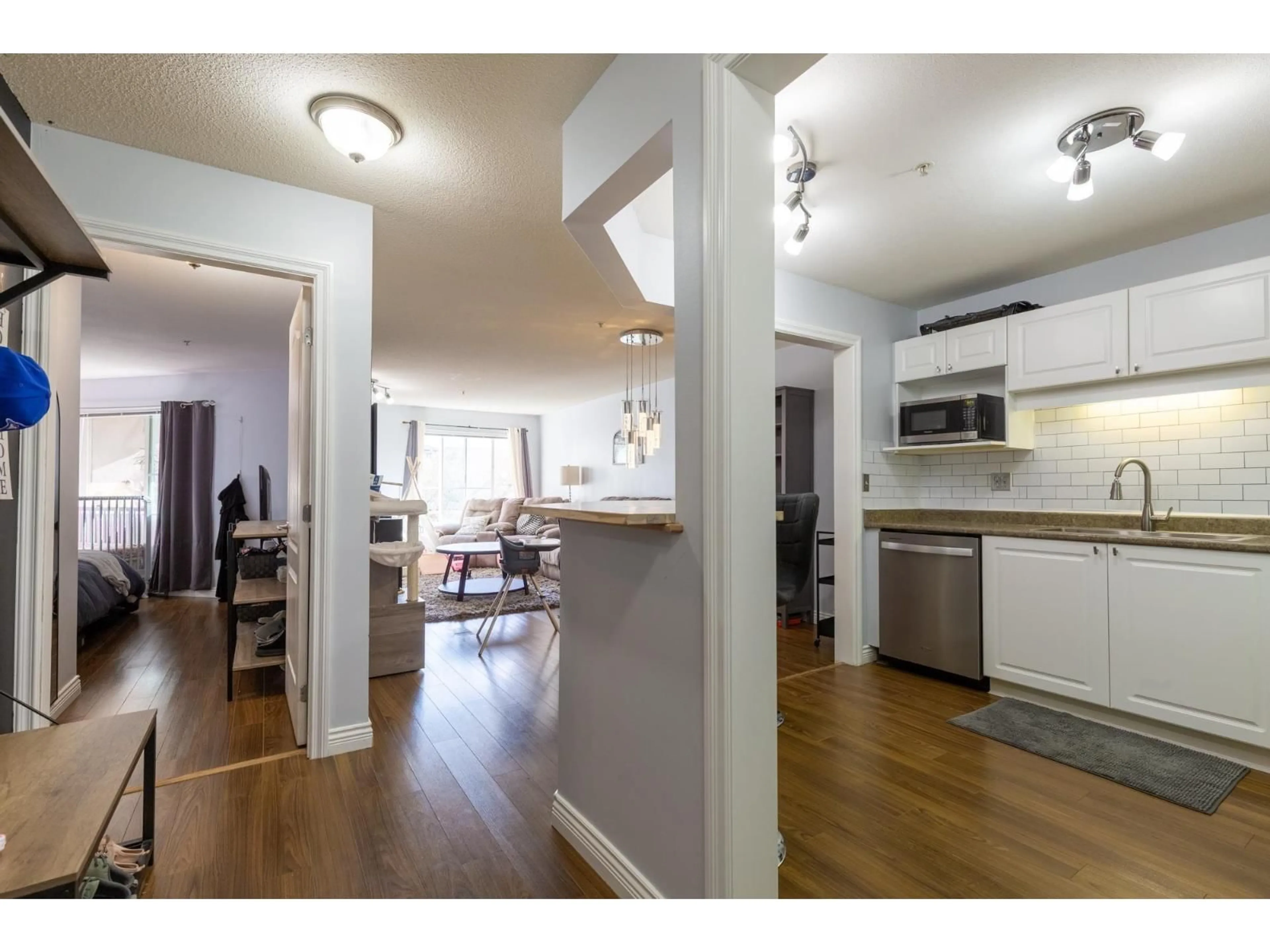 Open concept kitchen, wood/laminate floor for 201 - 5765 GLOVER ROAD, Langley British Columbia V3A8M8