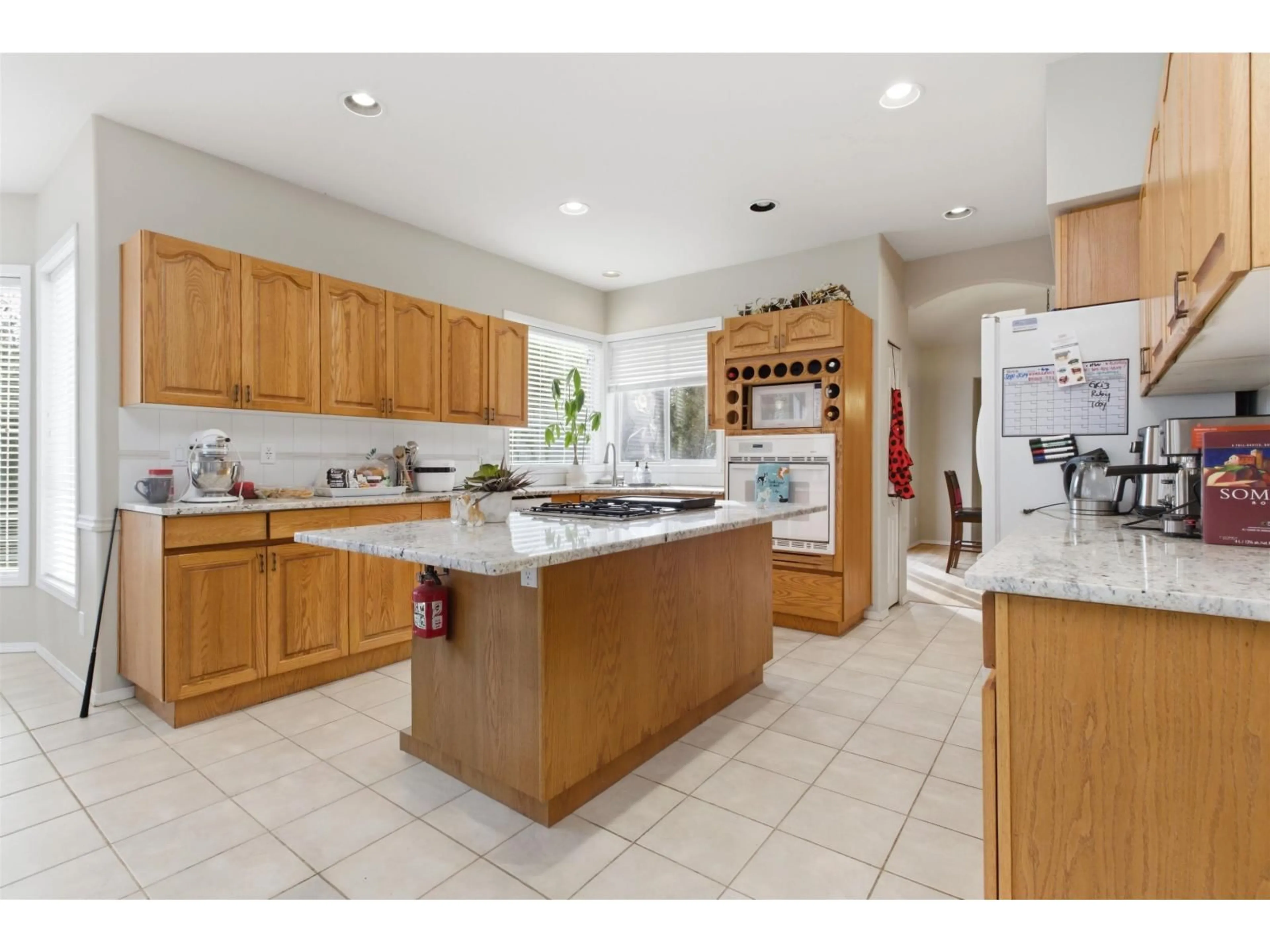 Open concept kitchen, ceramic/tile floor for 4570 MAYSFIELD CRESCENT, Langley British Columbia V3A4M1