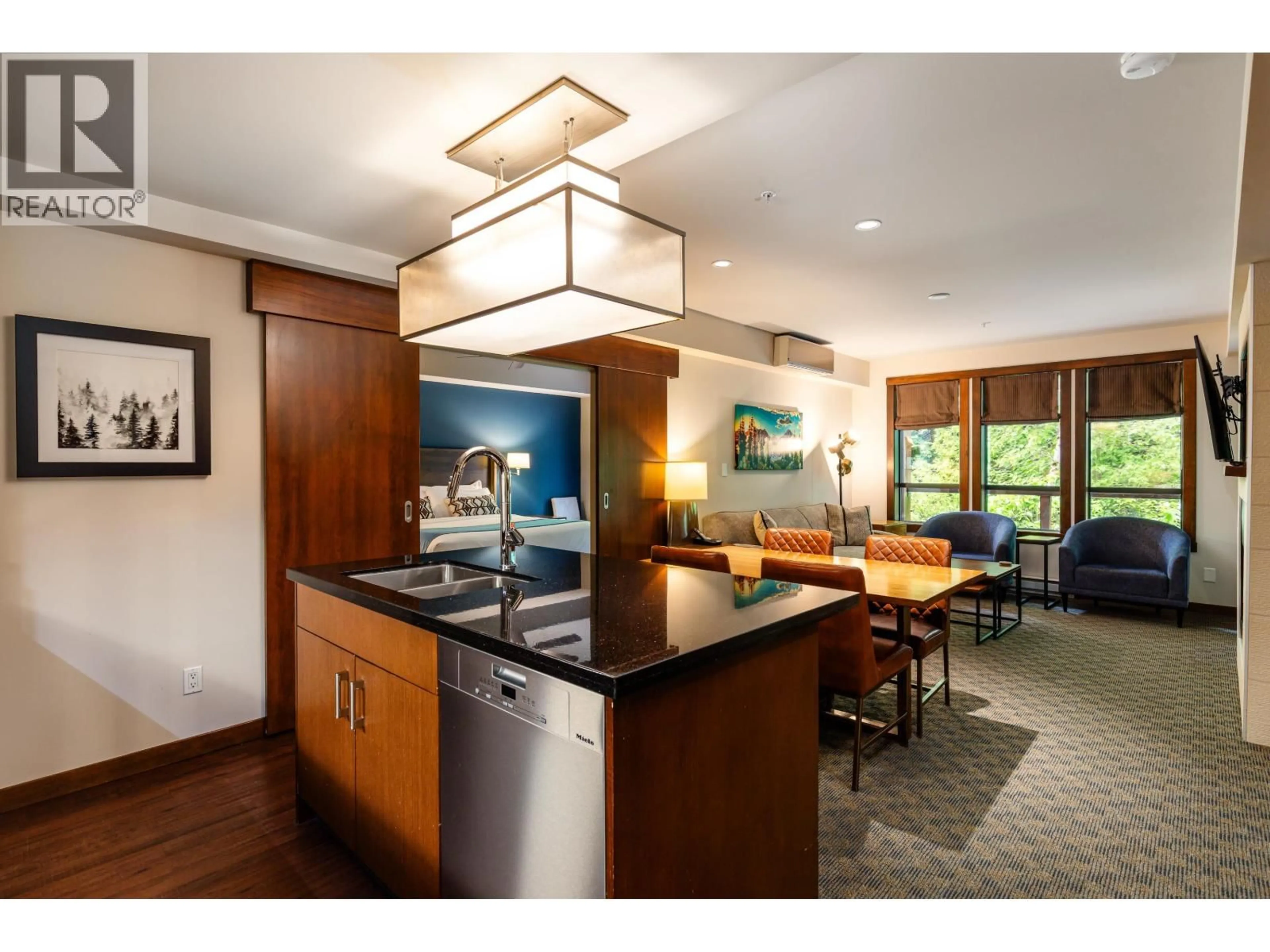 Open concept kitchen, wood/laminate floor for 103B - 2020 LONDON LANE, Whistler British Columbia V0N1B2