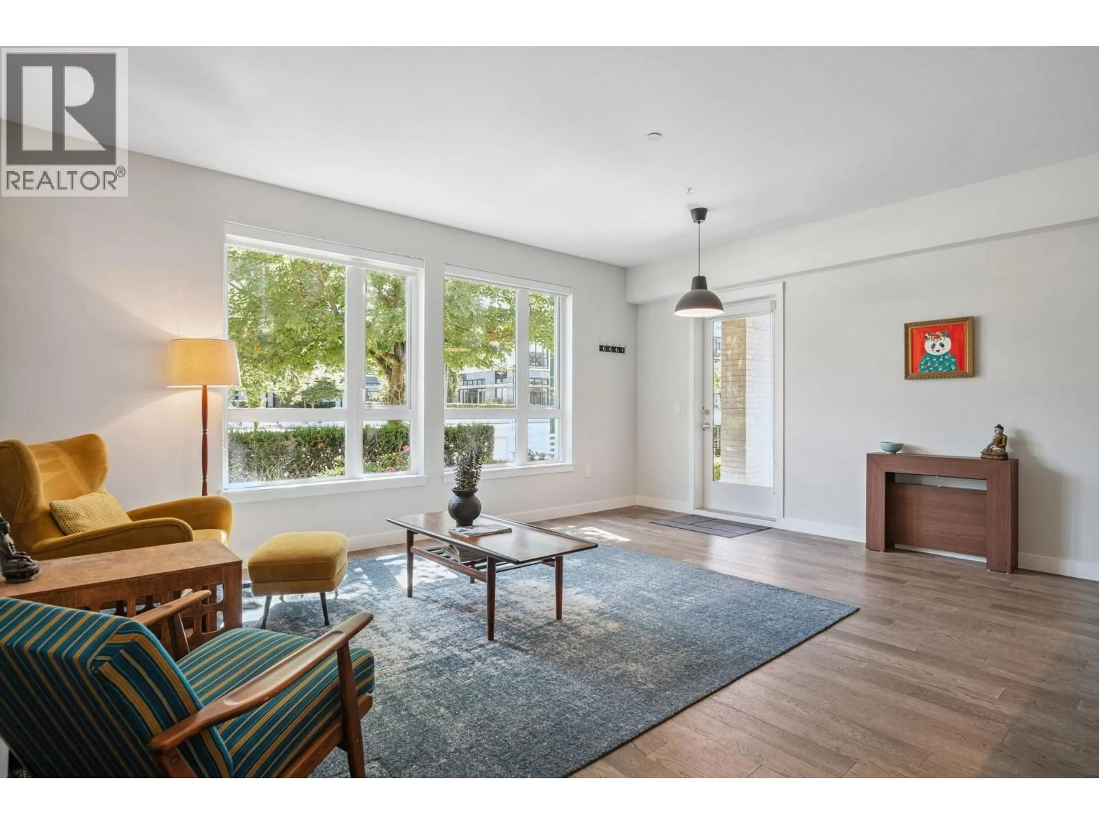 Living room with furniture, wood/laminate floor for 110 - 4080 YUKON STREET, Vancouver British Columbia V5Y0L4