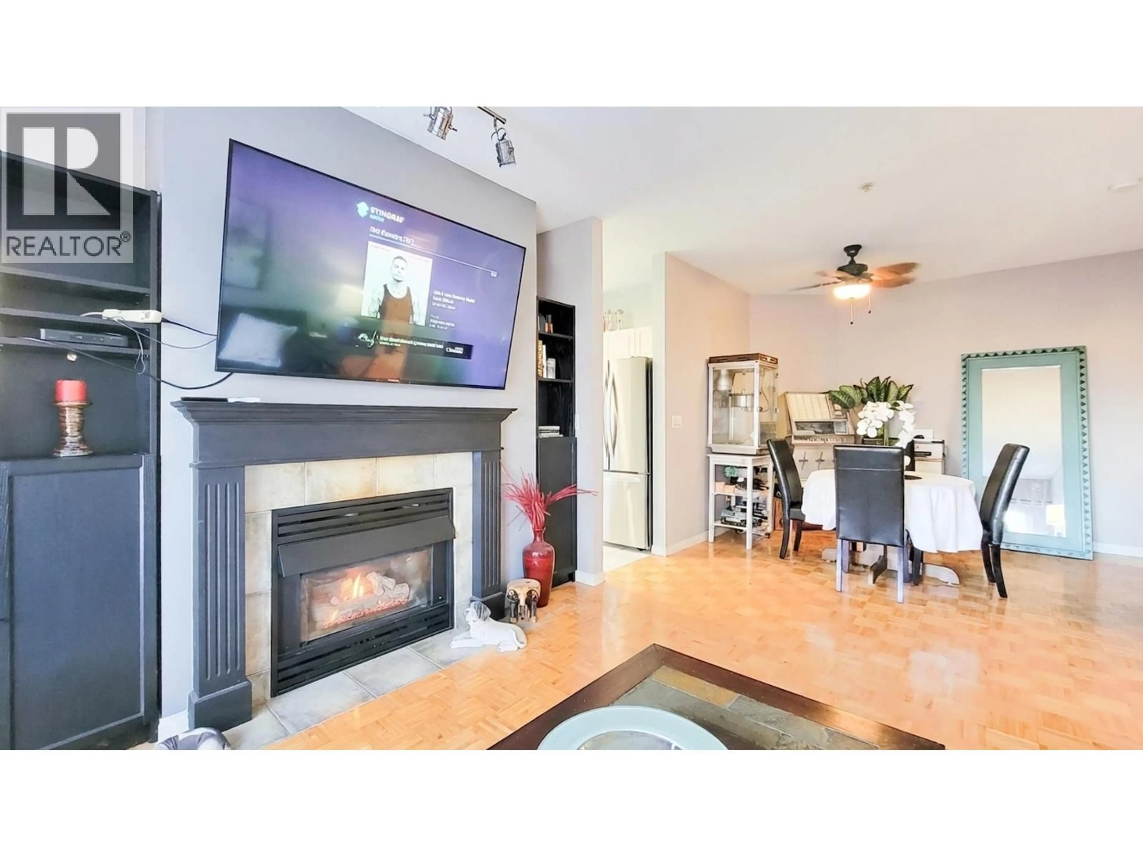 Living room with furniture, wood/laminate floor for 202 - 19091 MCMYN ROAD, Pitt Meadows British Columbia V3Y2S8