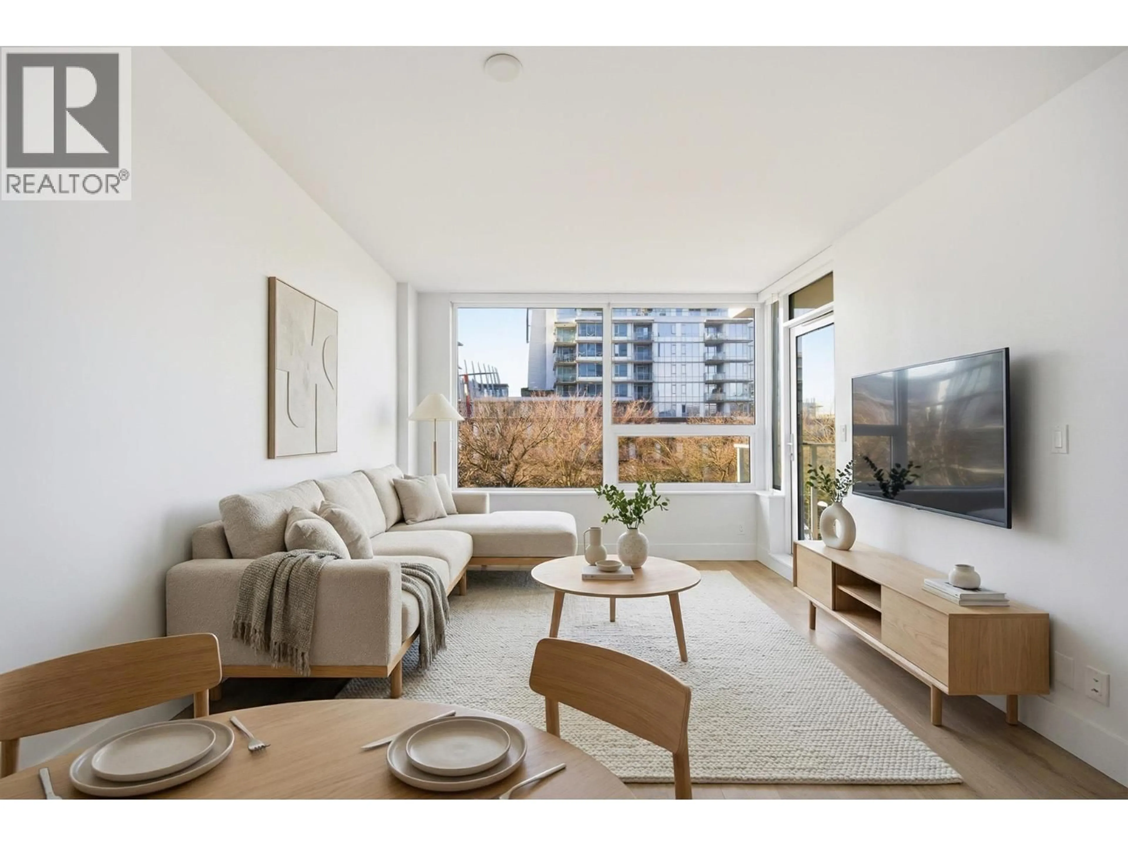Living room with furniture, wood/laminate floor for 504 - 5508 HOLLYBRIDGE WAY, Richmond British Columbia V7C0C7