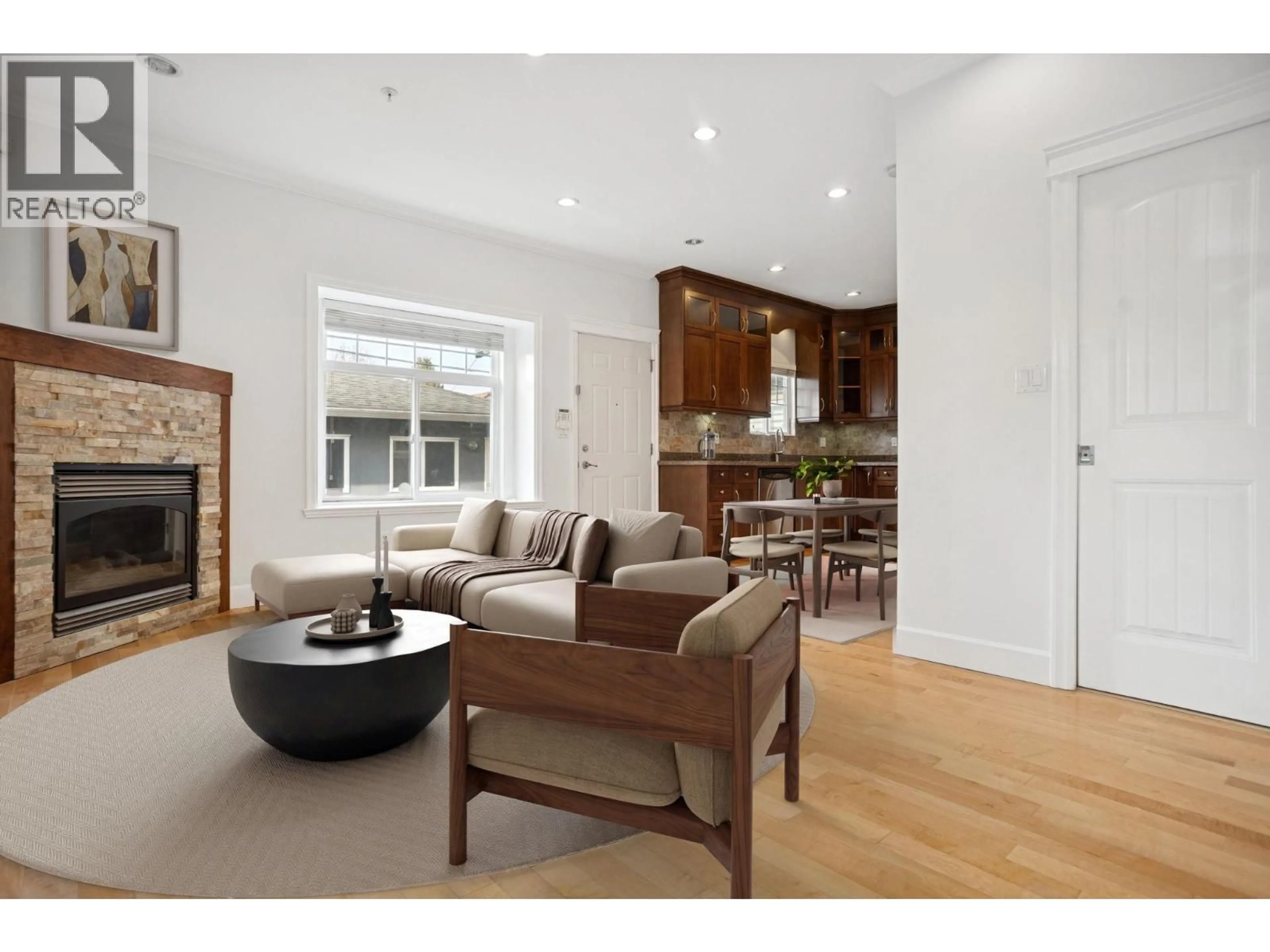 Living room with furniture, wood/laminate floor for 6453 BEATRICE STREET, Vancouver British Columbia V5P3R5
