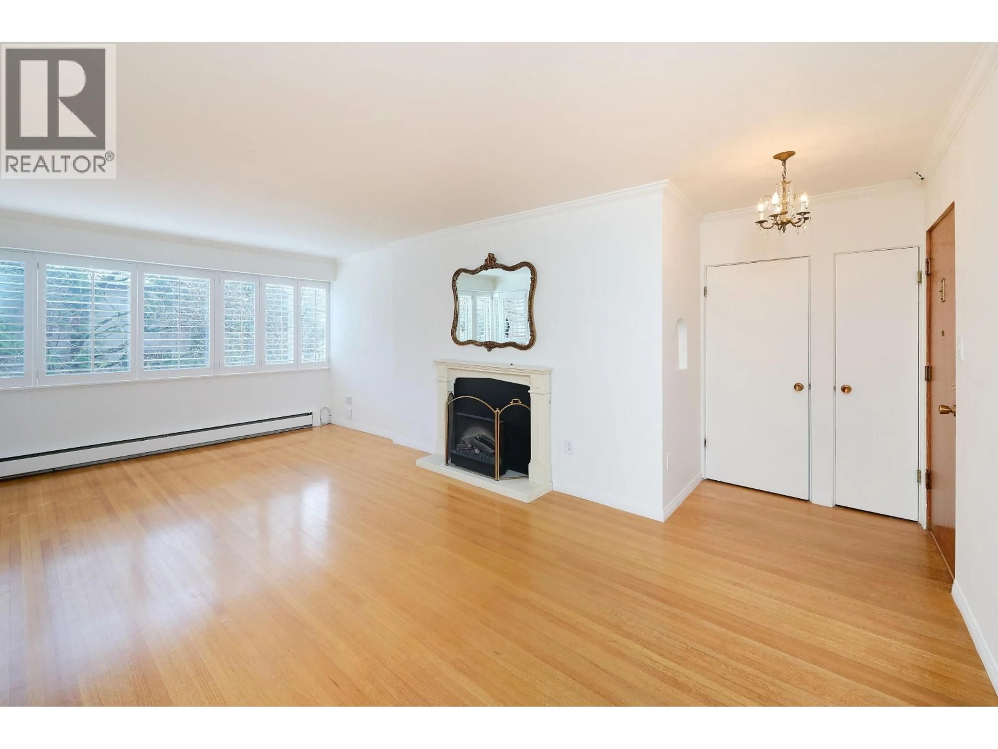 Living room with furniture, wood/laminate floor for 302 - 1315 CARDERO STREET, Vancouver British Columbia V6G2J2