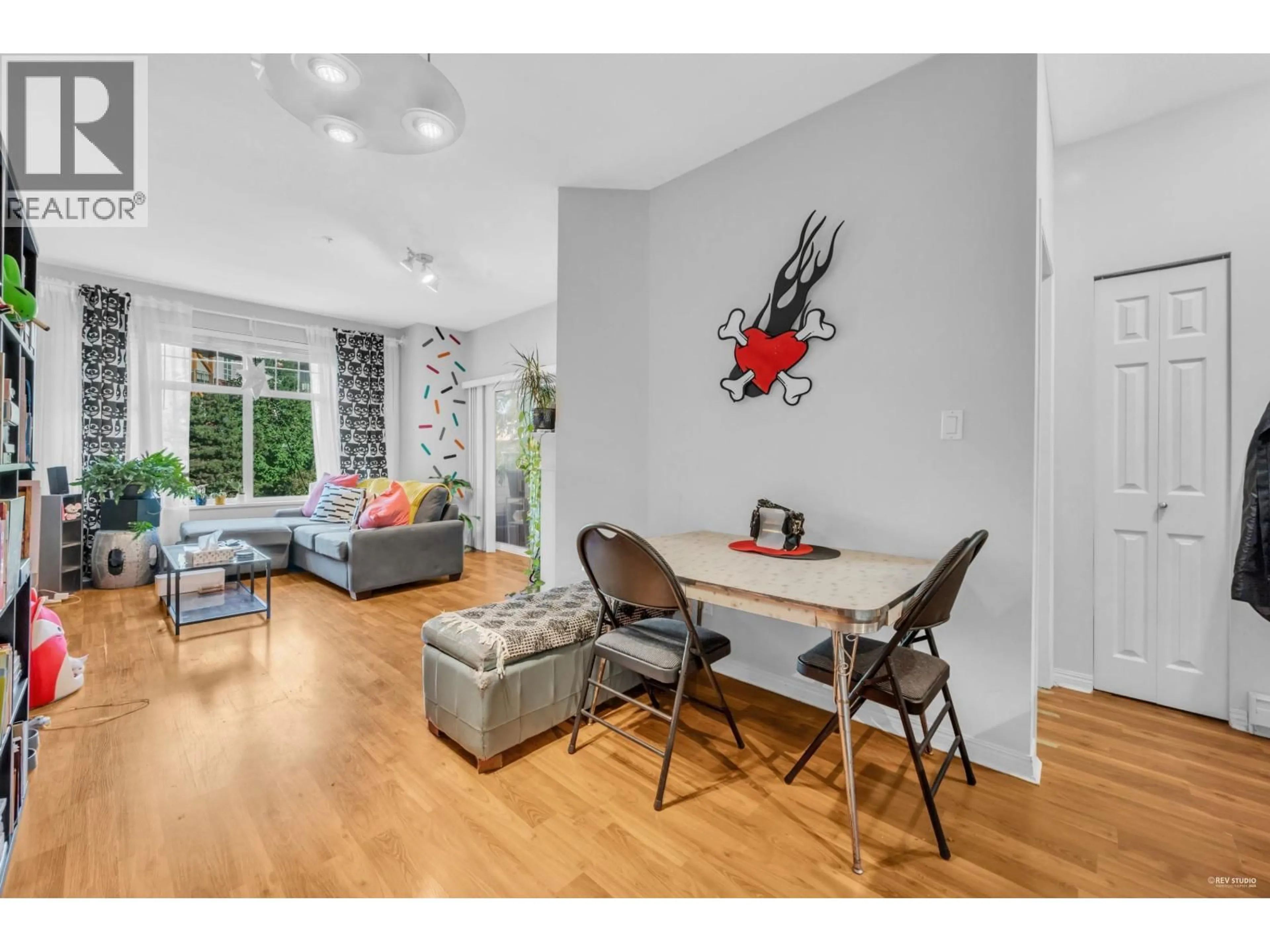 Living room with furniture, wood/laminate floor for 213 - 83 STAR CRESCENT, New Westminster British Columbia V3M6X8