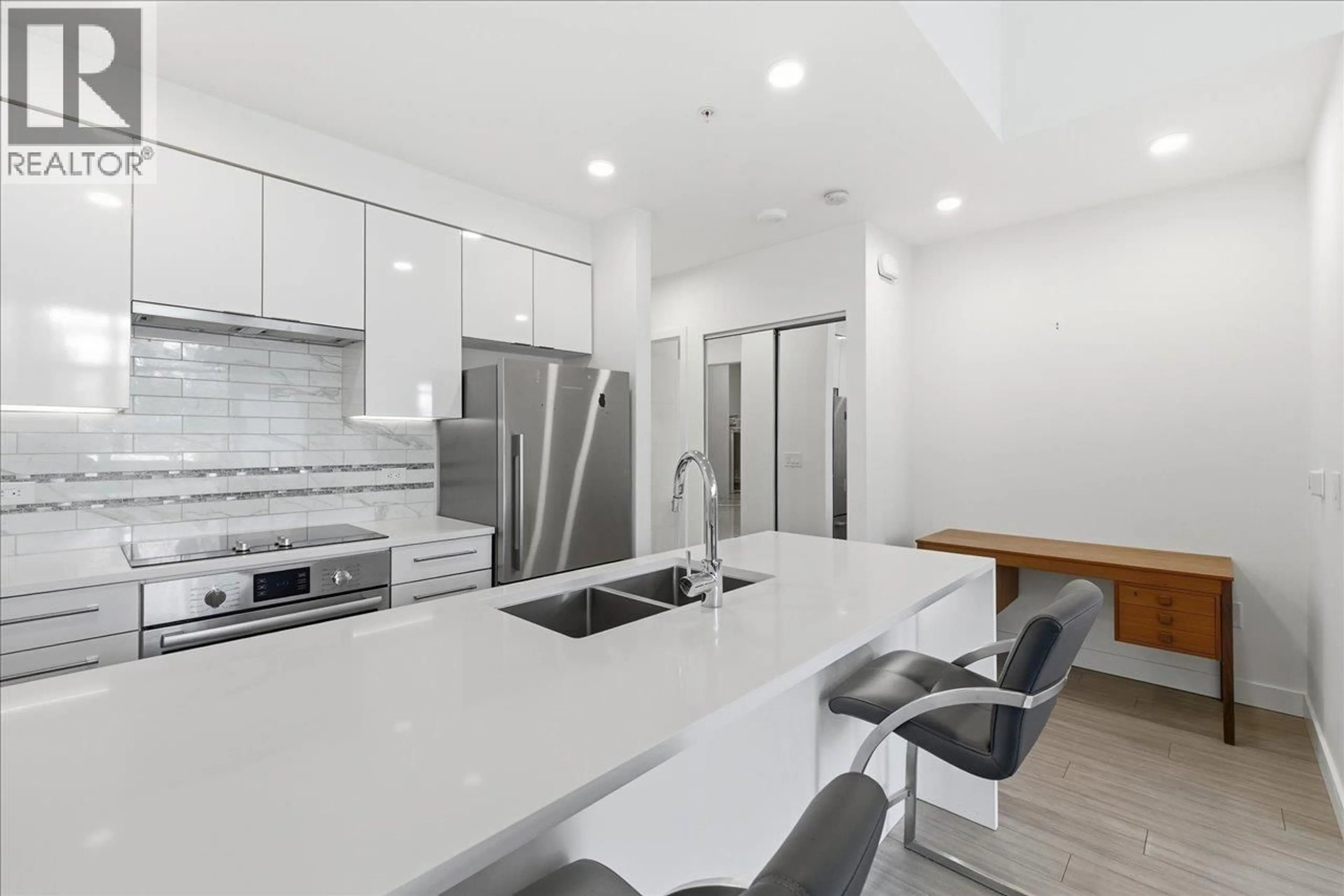 Open concept kitchen, unknown for 104 - 438 KING EDWARD AVENUE, Vancouver British Columbia V5Y0M5