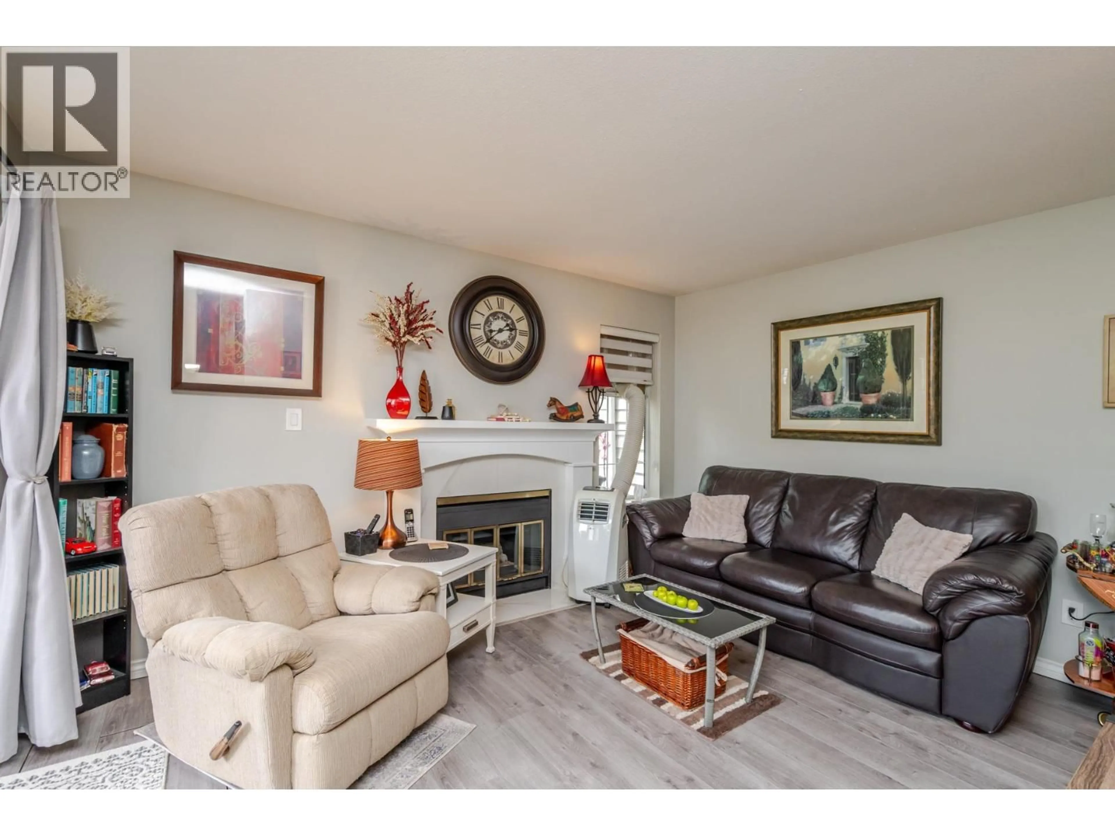 Living room with furniture, wood/laminate floor for 103 - 11578 225 STREET, Maple Ridge British Columbia V2X9W7
