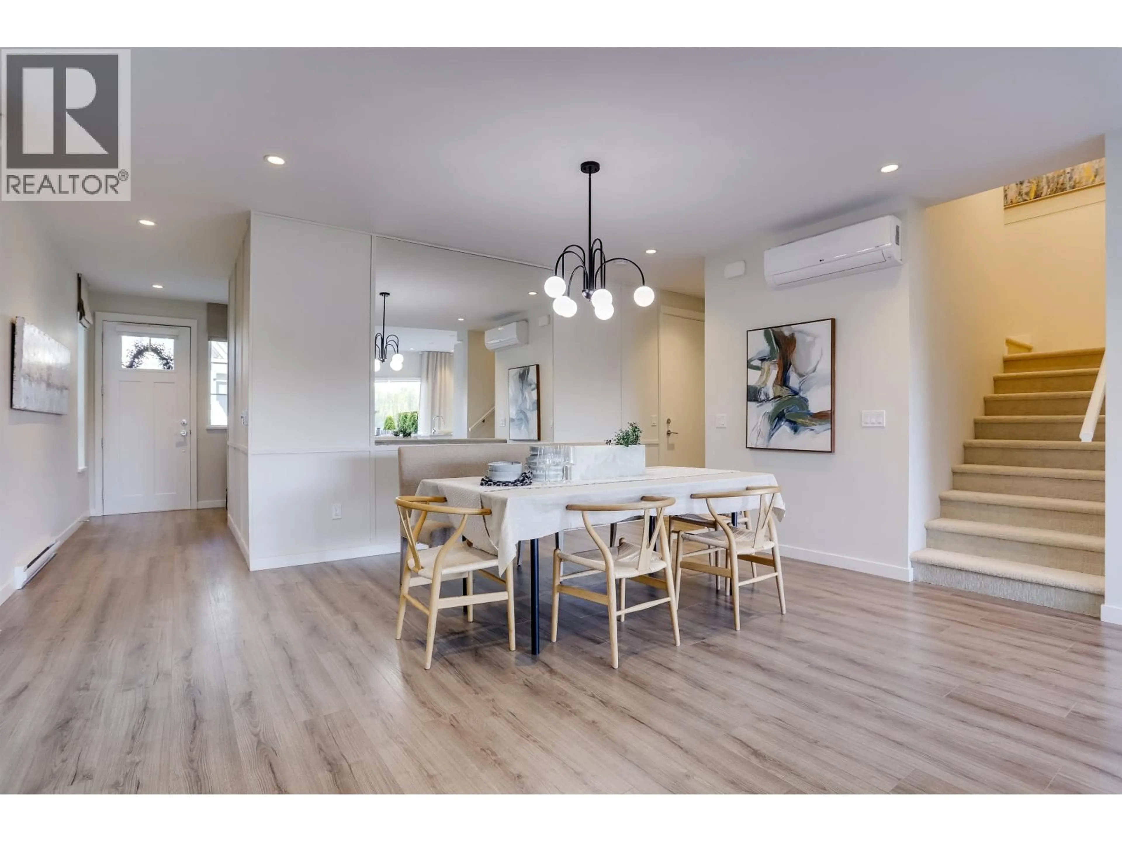 Open concept kitchen, wood/laminate floor for 100 - 5311 ADMIRAL WAY, Delta British Columbia V4K0E2