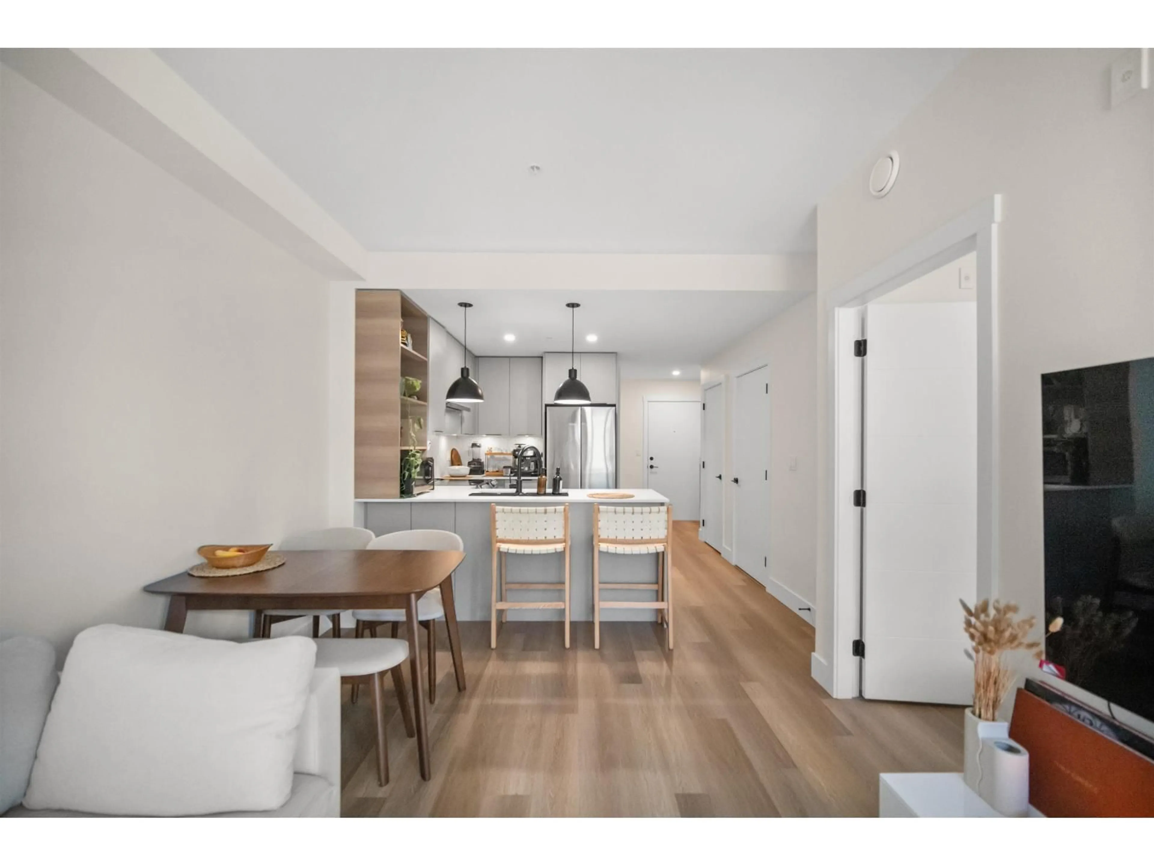 Open concept kitchen, wood/laminate floor for 307 - 10778 138 STREET, Surrey British Columbia V3T0S5