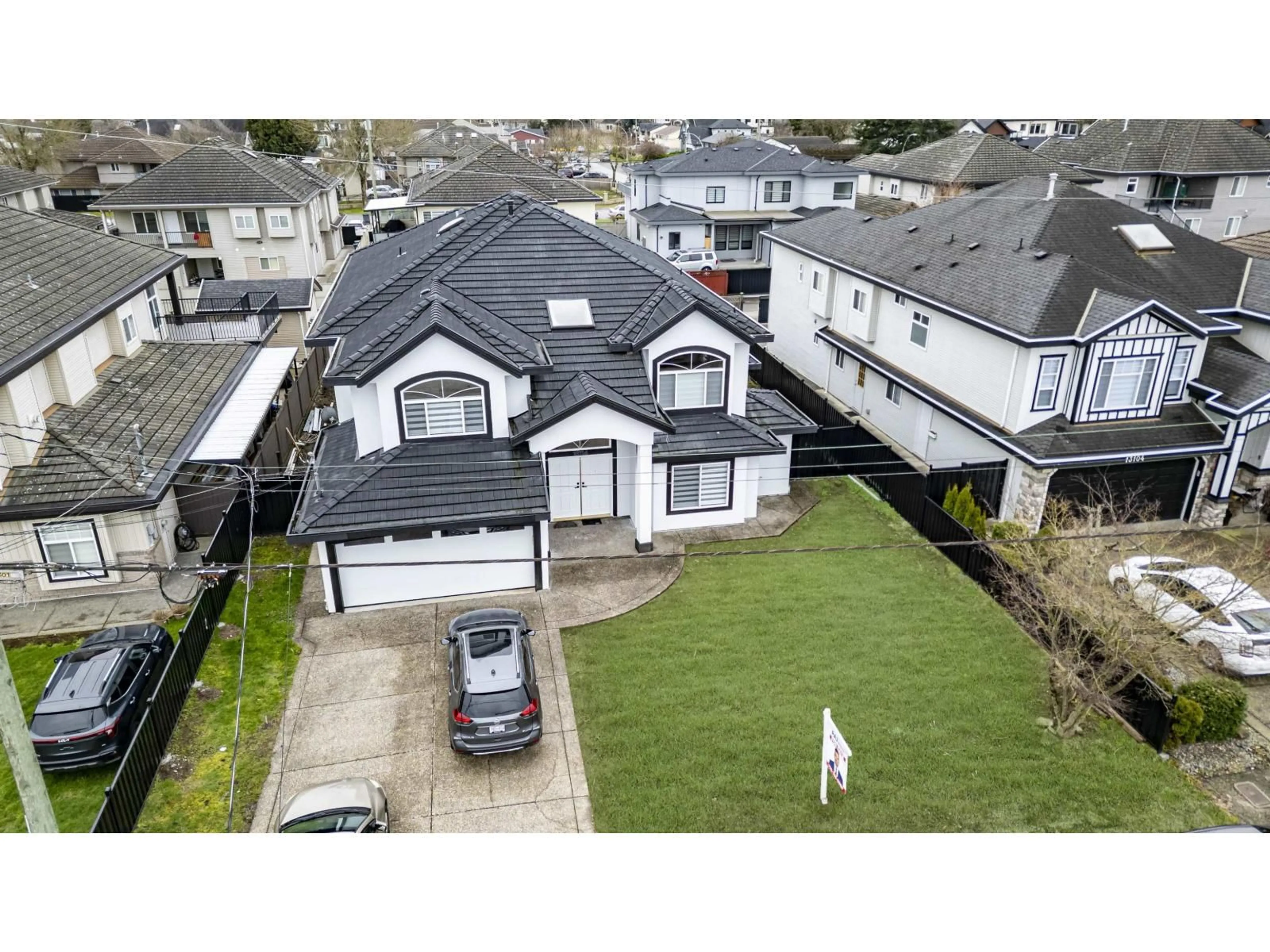 A pic from outside/outdoor area/front of a property/back of a property/a pic from drone, street for 13114 73A AVENUE, Surrey British Columbia V3W2R7