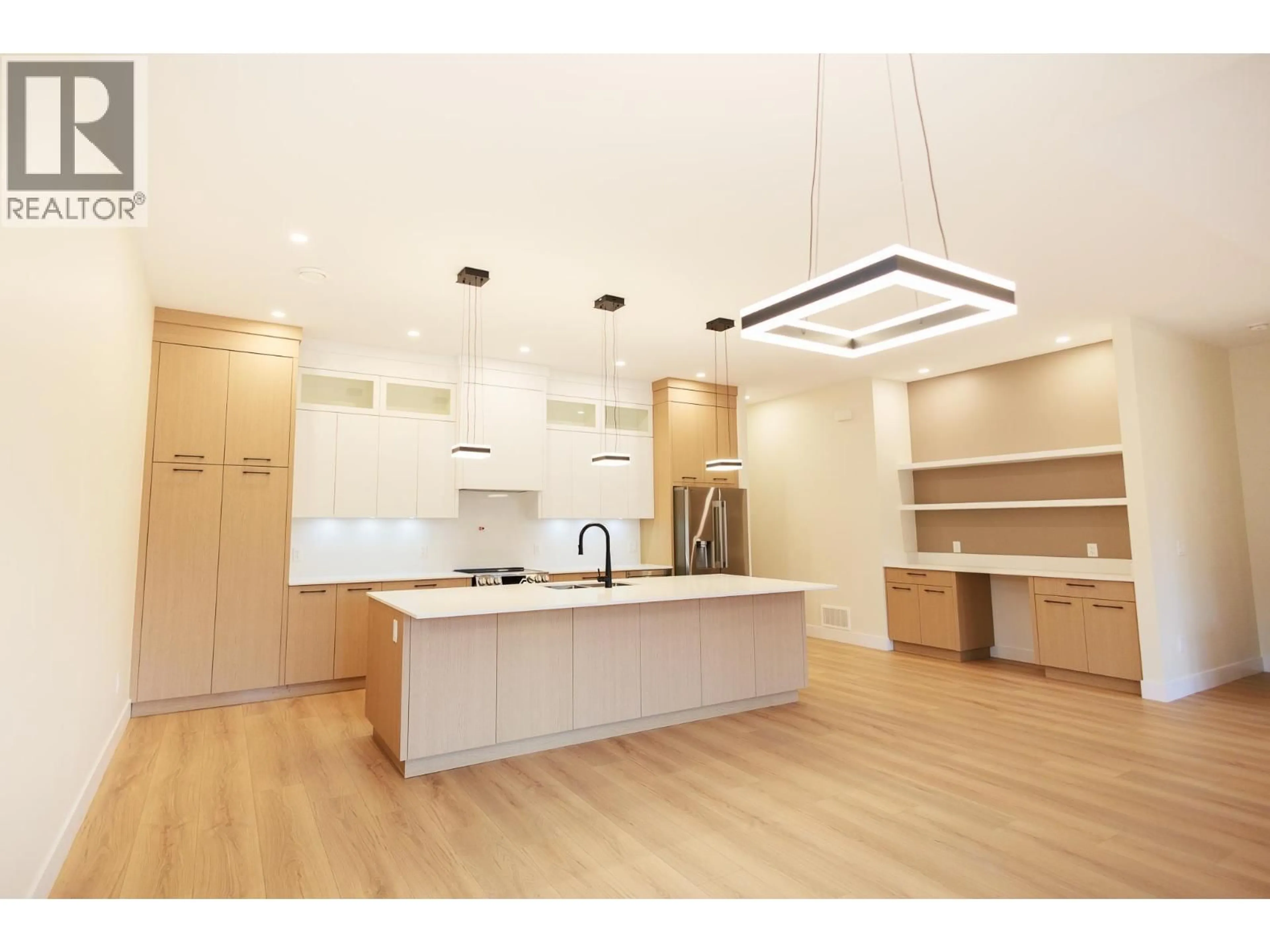 Open concept kitchen, wood/laminate floor for 4008 NASH DRIVE, Terrace British Columbia V8G0L3