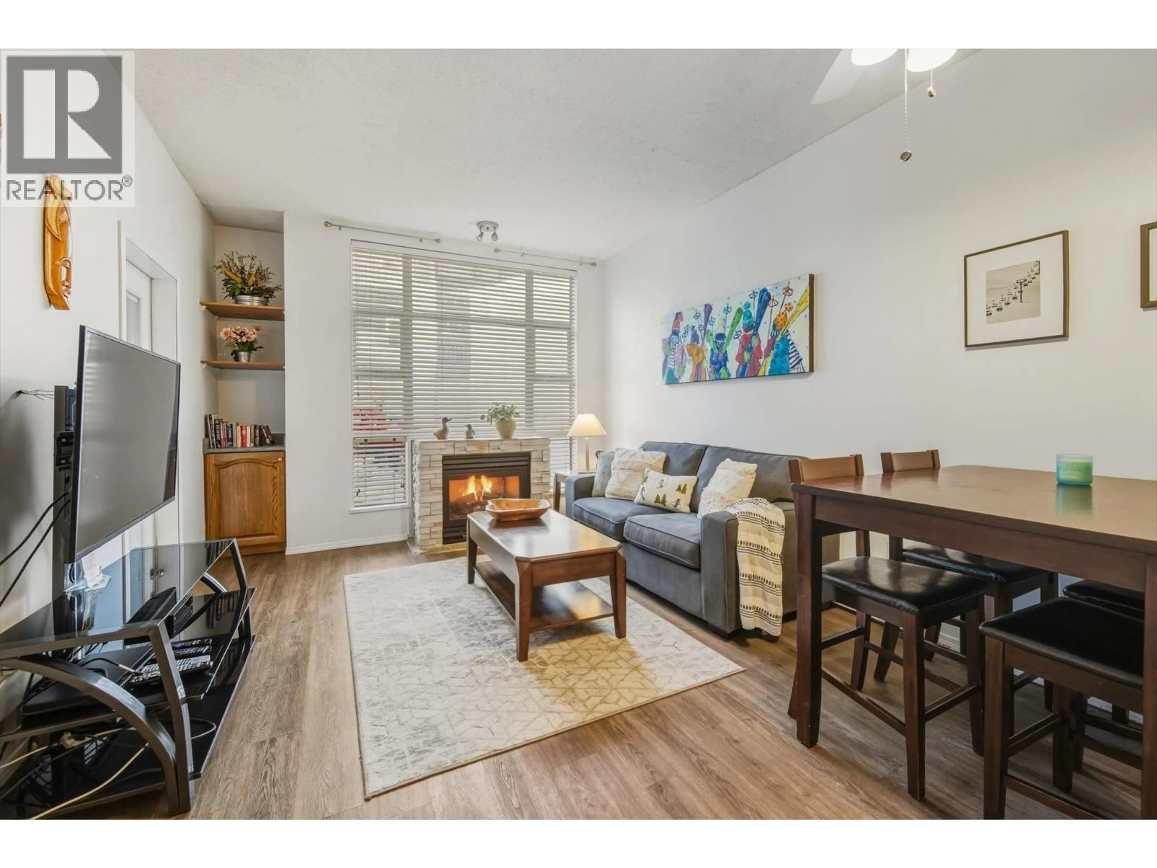 Living room with furniture, wood/laminate floor for 106 - 4573 CHATEAU BOULEVARD, Whistler British Columbia V0N1B4