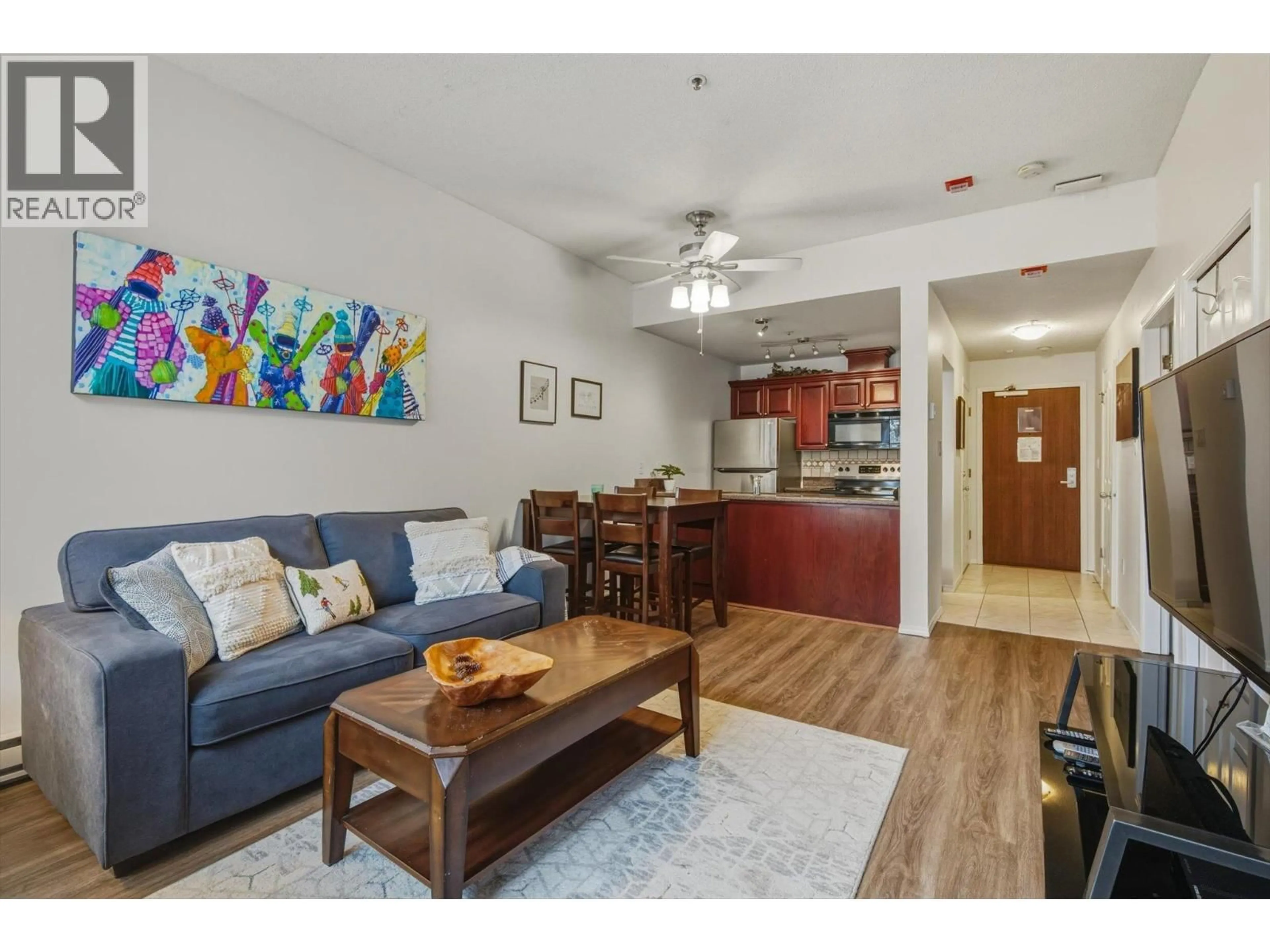 Living room with furniture, wood/laminate floor for 106 - 4573 CHATEAU BOULEVARD, Whistler British Columbia V0N1B4