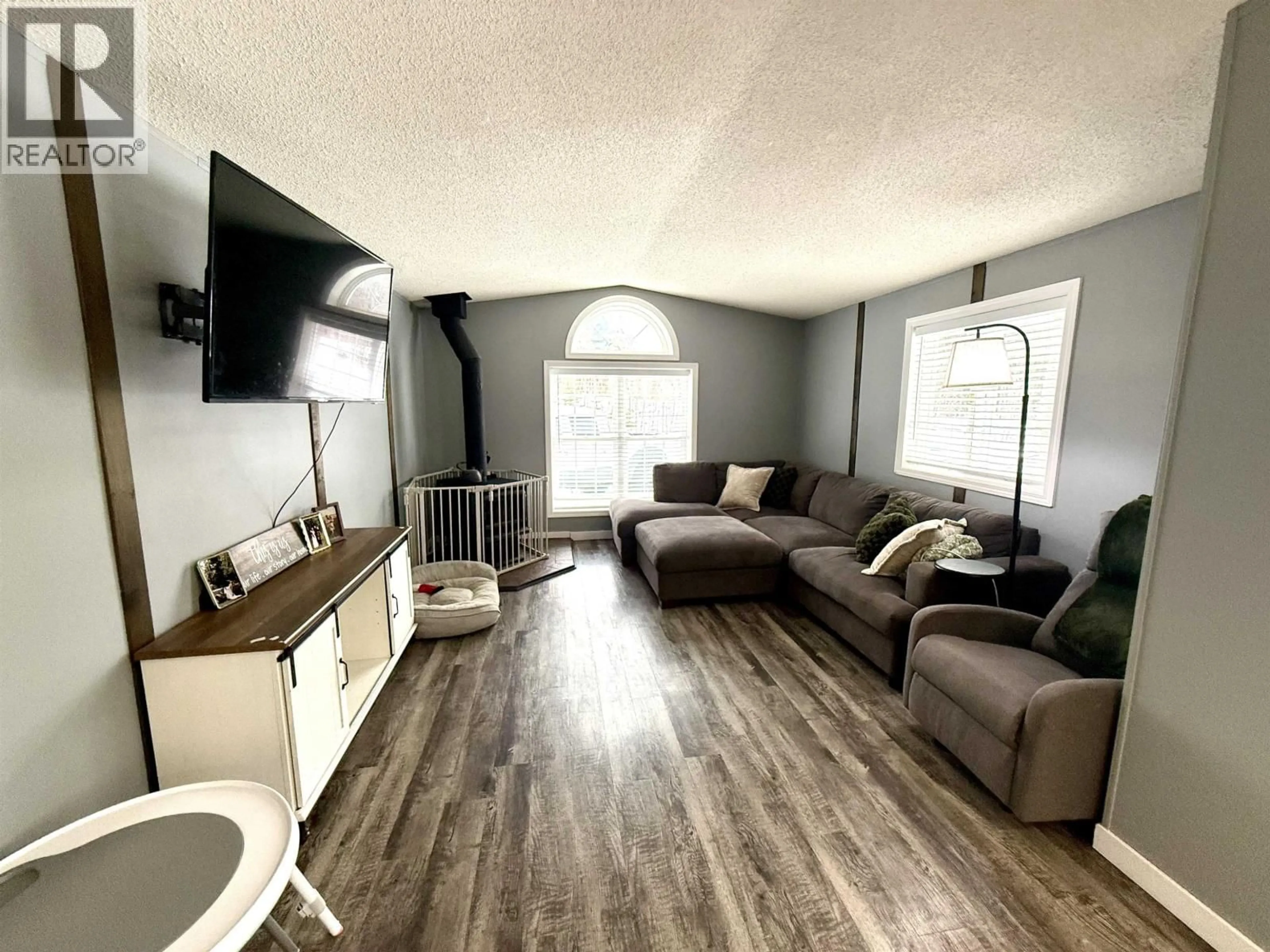 Living room with furniture, wood/laminate floor for 1085 GROVEBURN ROAD, Prince George British Columbia V2N6W8