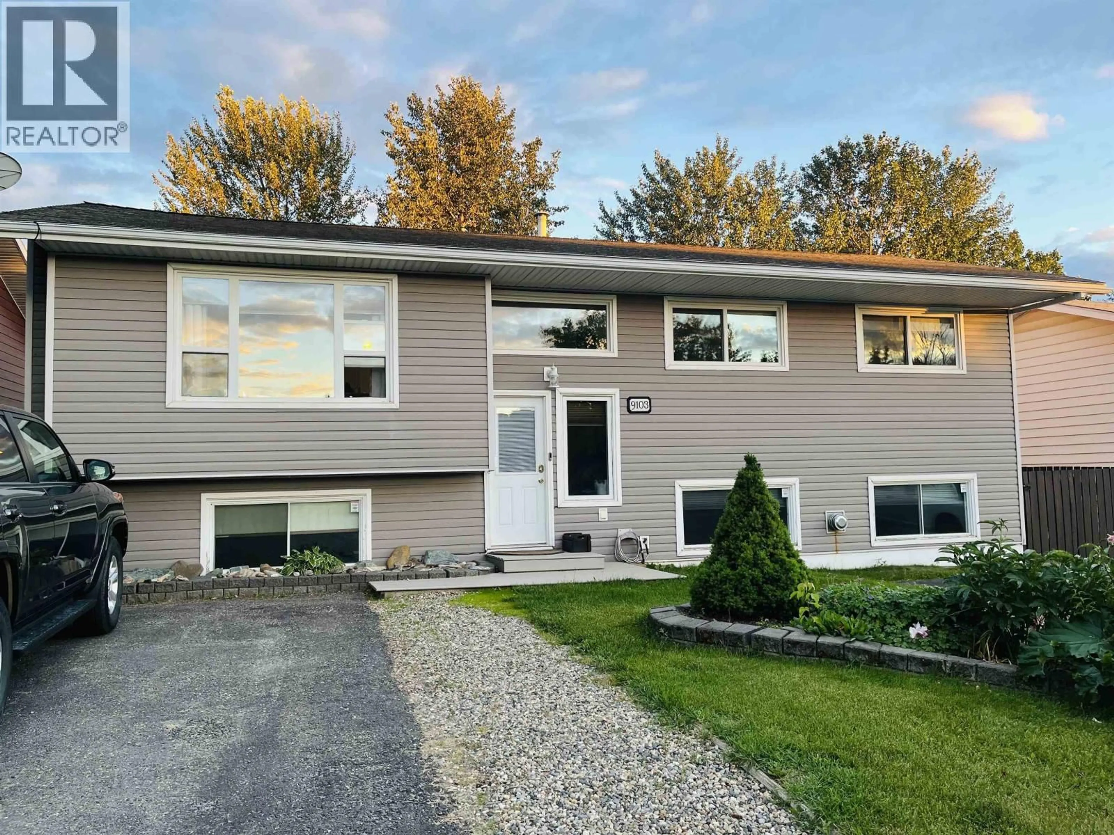 Home with vinyl exterior material, street for 9103 96A AVENUE, Fort St. John British Columbia V1J5G1