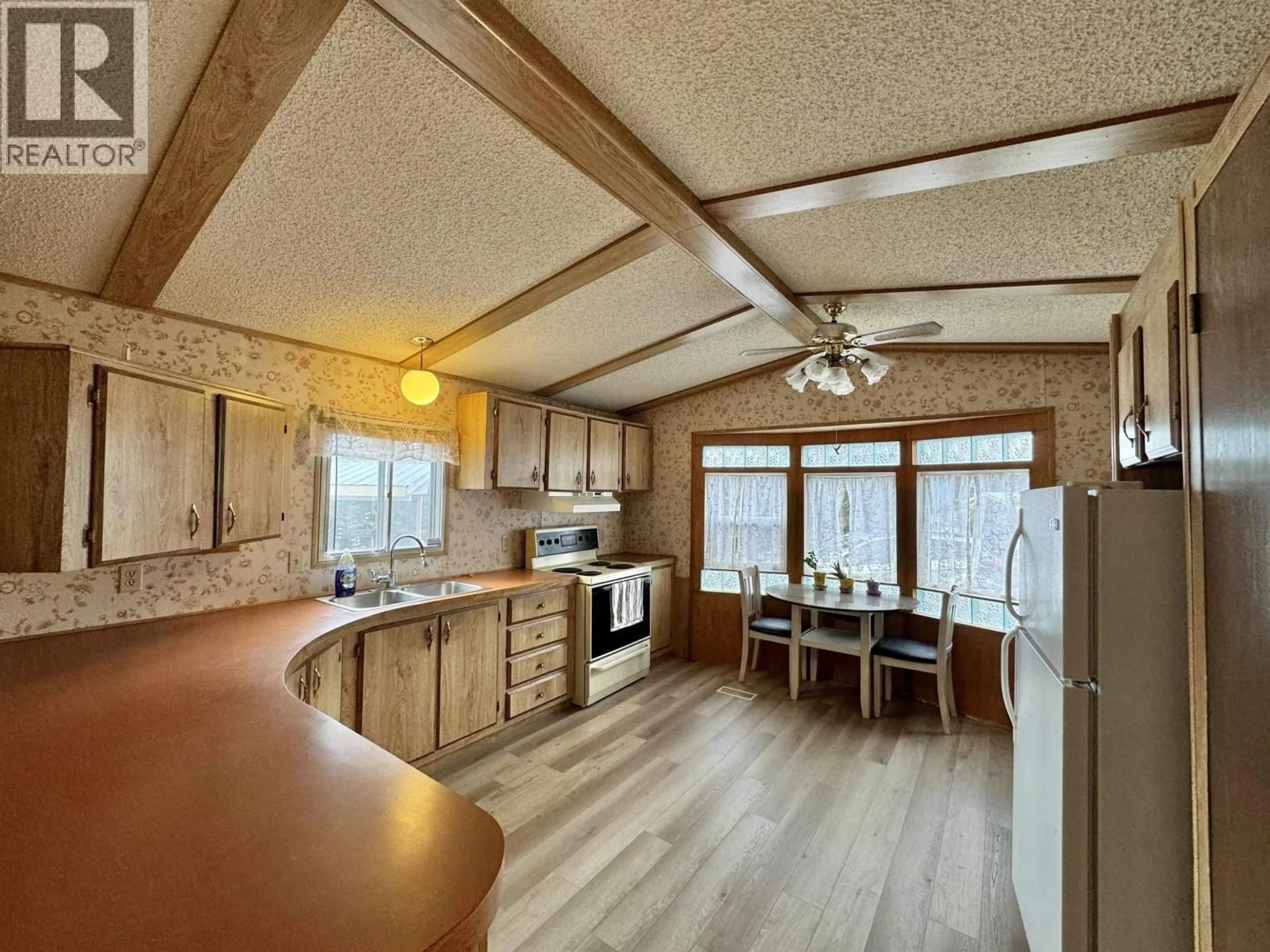 Open concept kitchen, wood/laminate floor for 54 - 770 11TH AVENUE, Williams Lake British Columbia V2G2M4