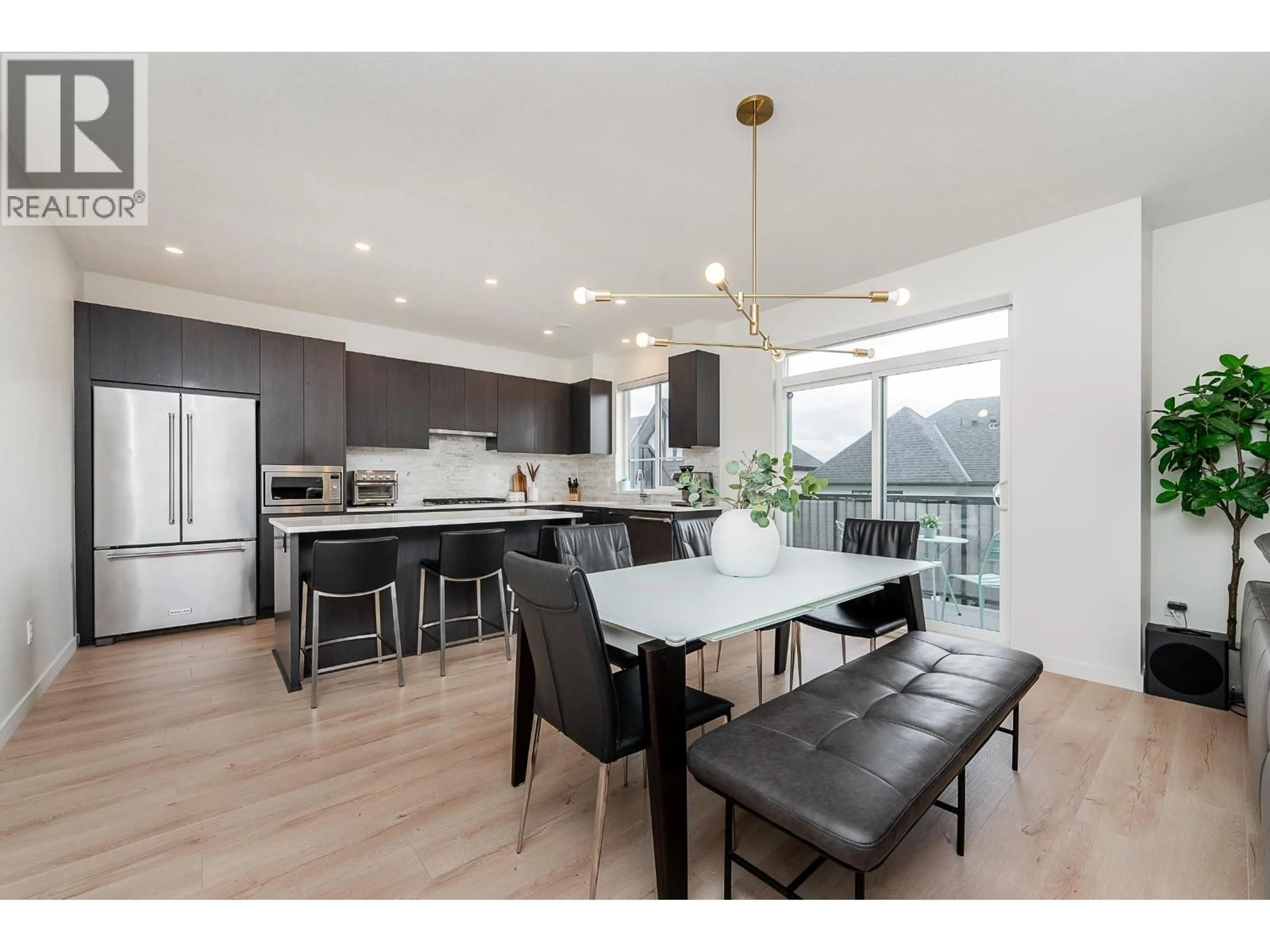 Open concept kitchen, wood/laminate floor for 59 - 3500 BURKE VILLAGE PROMENADE, Coquitlam British Columbia V3E0N2