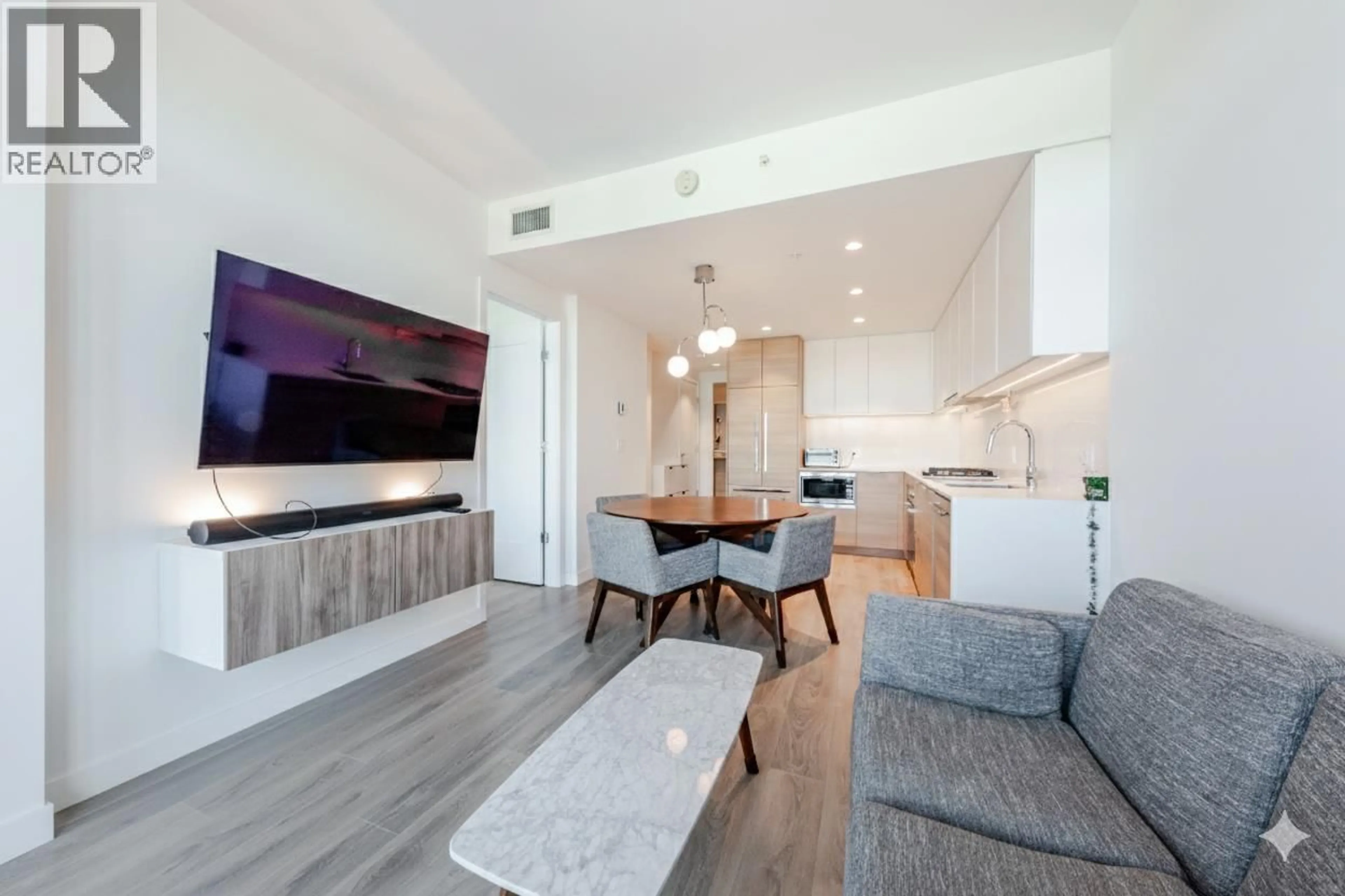 Living room with furniture, wood/laminate floor for 808 - 1045 AUSTIN AVENUE, Coquitlam British Columbia V3K0G9