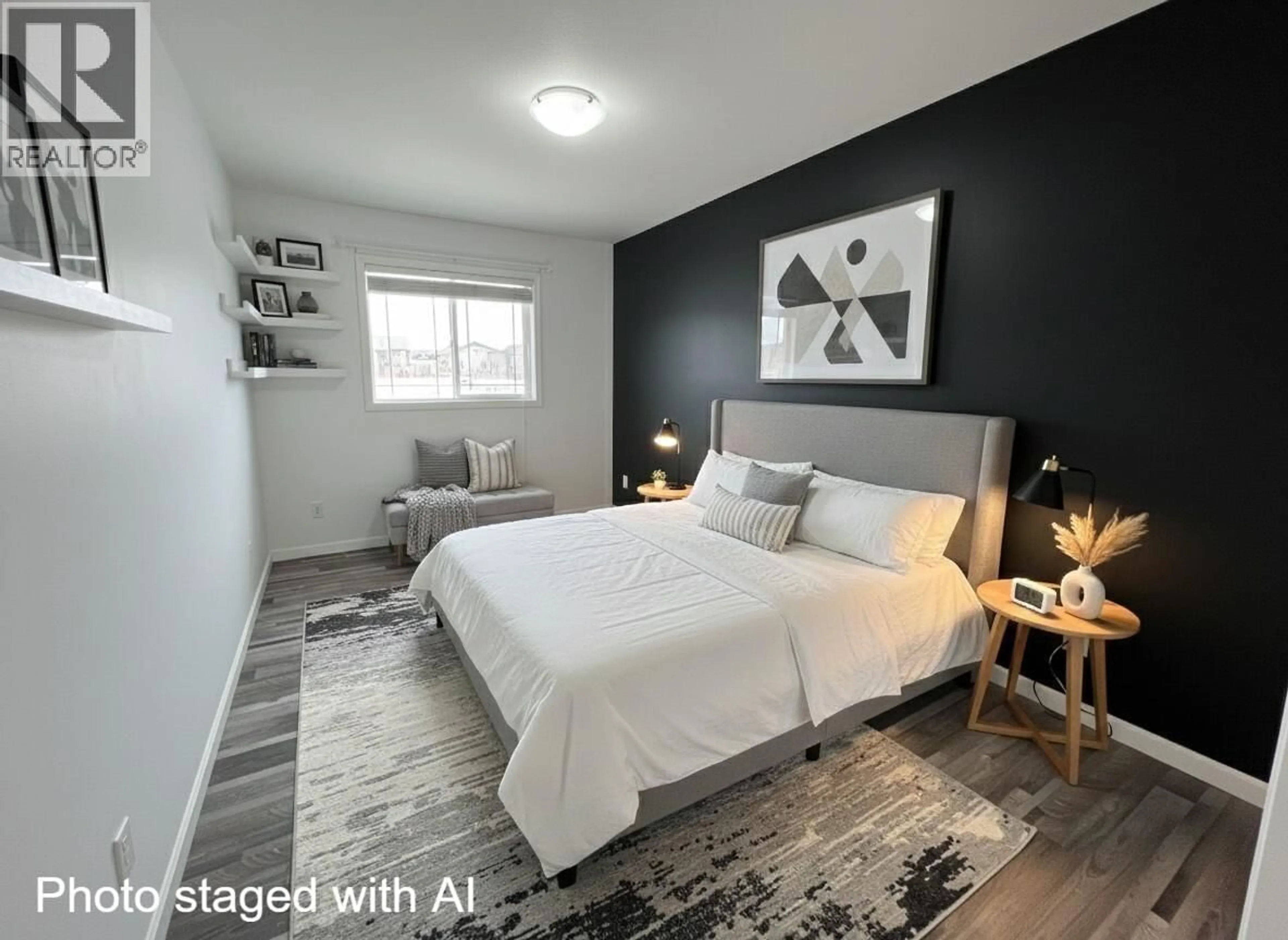 Bedroom with bed, wood/laminate floor for 8724 114 AVENUE, Fort St. John British Columbia V1J0C3