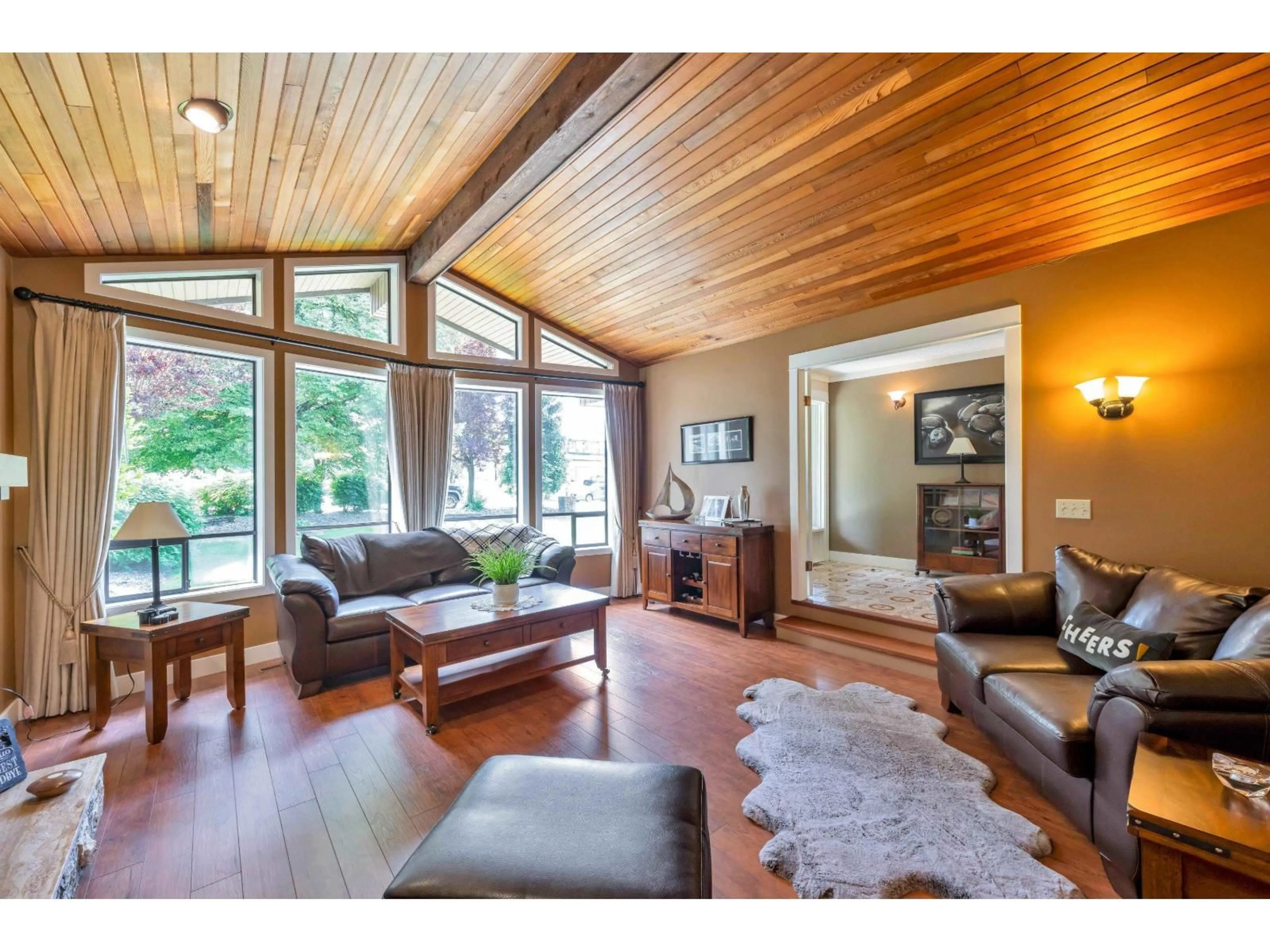Living room with furniture, wood/laminate floor for 21761 49A AVENUE, Langley British Columbia V3A6C4