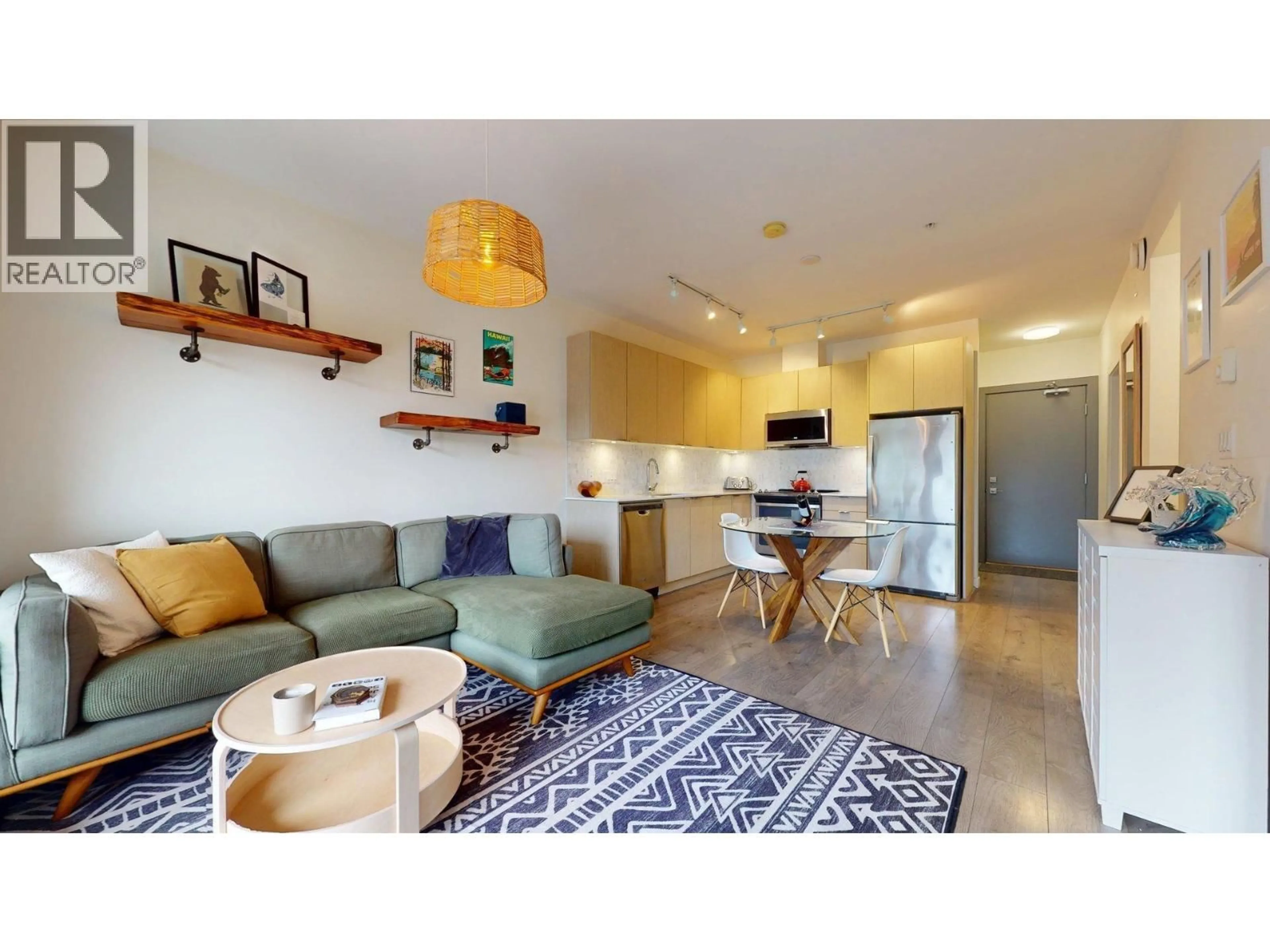 Living room with furniture, wood/laminate floor for 303 - 1150 BAILEY STREET, Squamish British Columbia V8B0R4