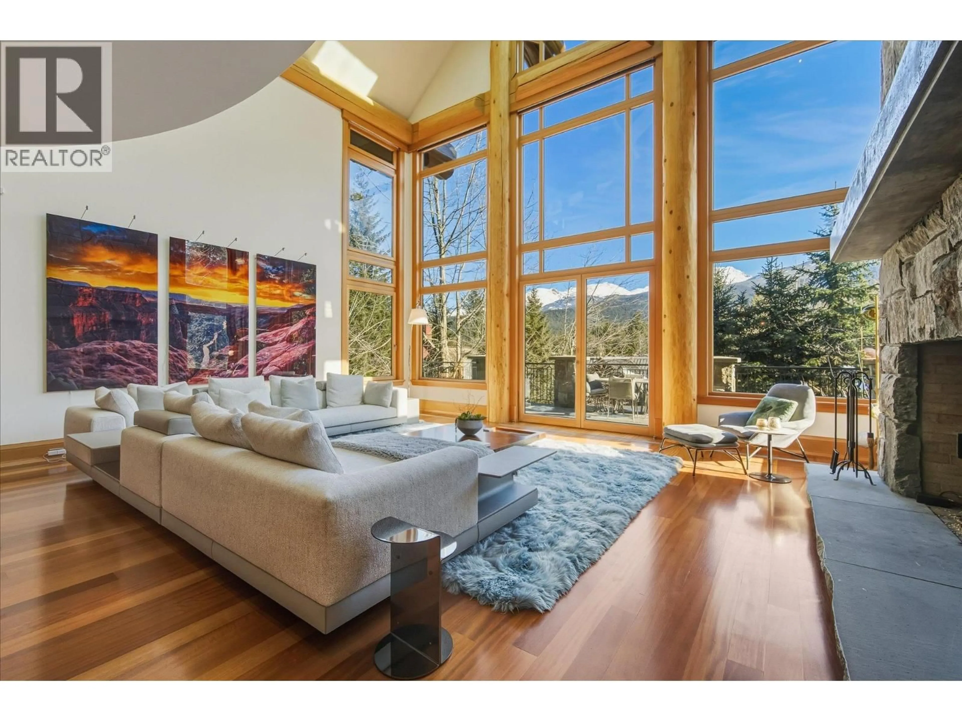 Living room with furniture, wood/laminate floor for 7425 TREETOP LANE, Whistler British Columbia V8E0E9