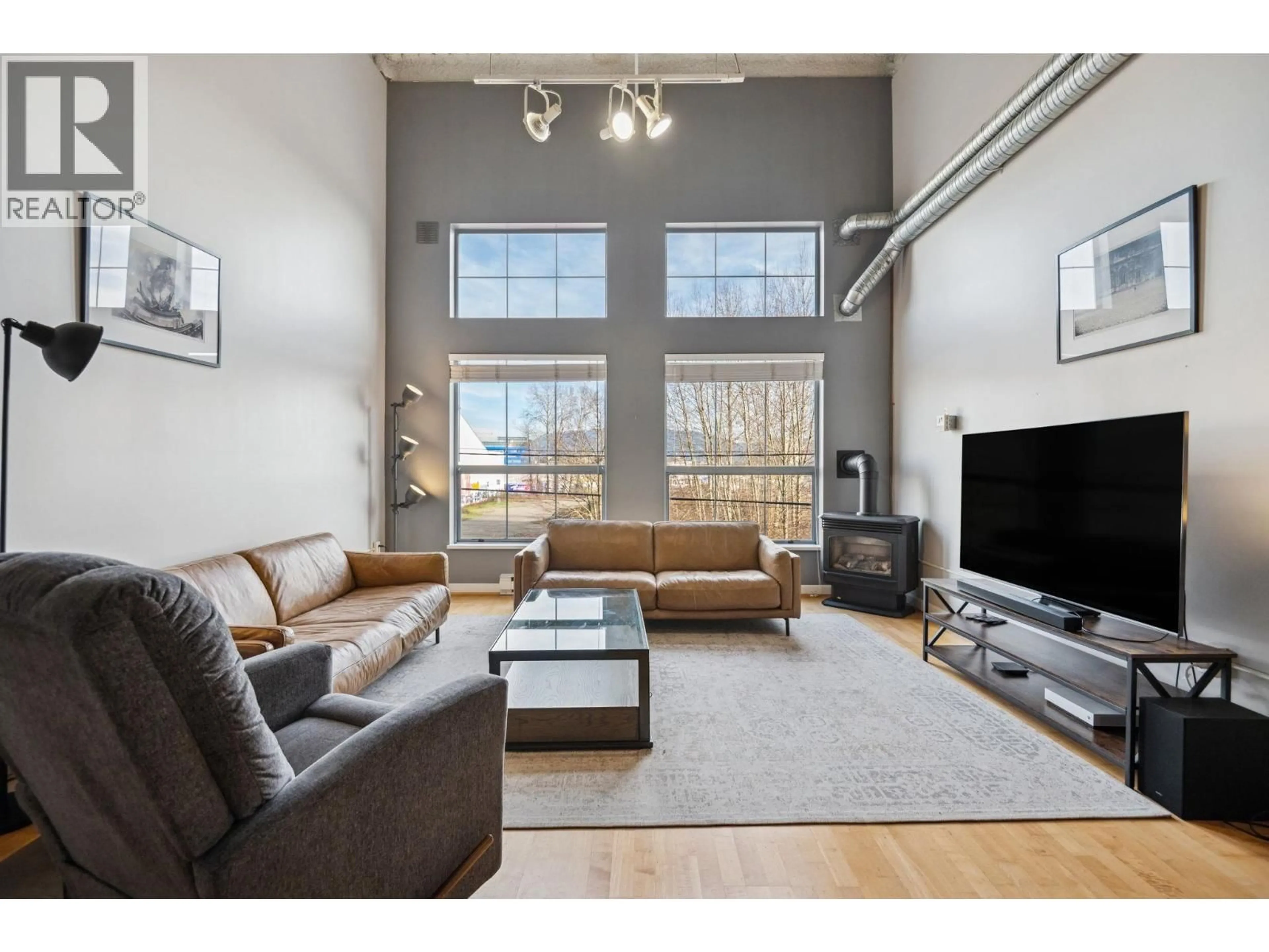 Living room with furniture, wood/laminate floor for 211 - 336 1ST AVENUE, Vancouver British Columbia V5T4R6