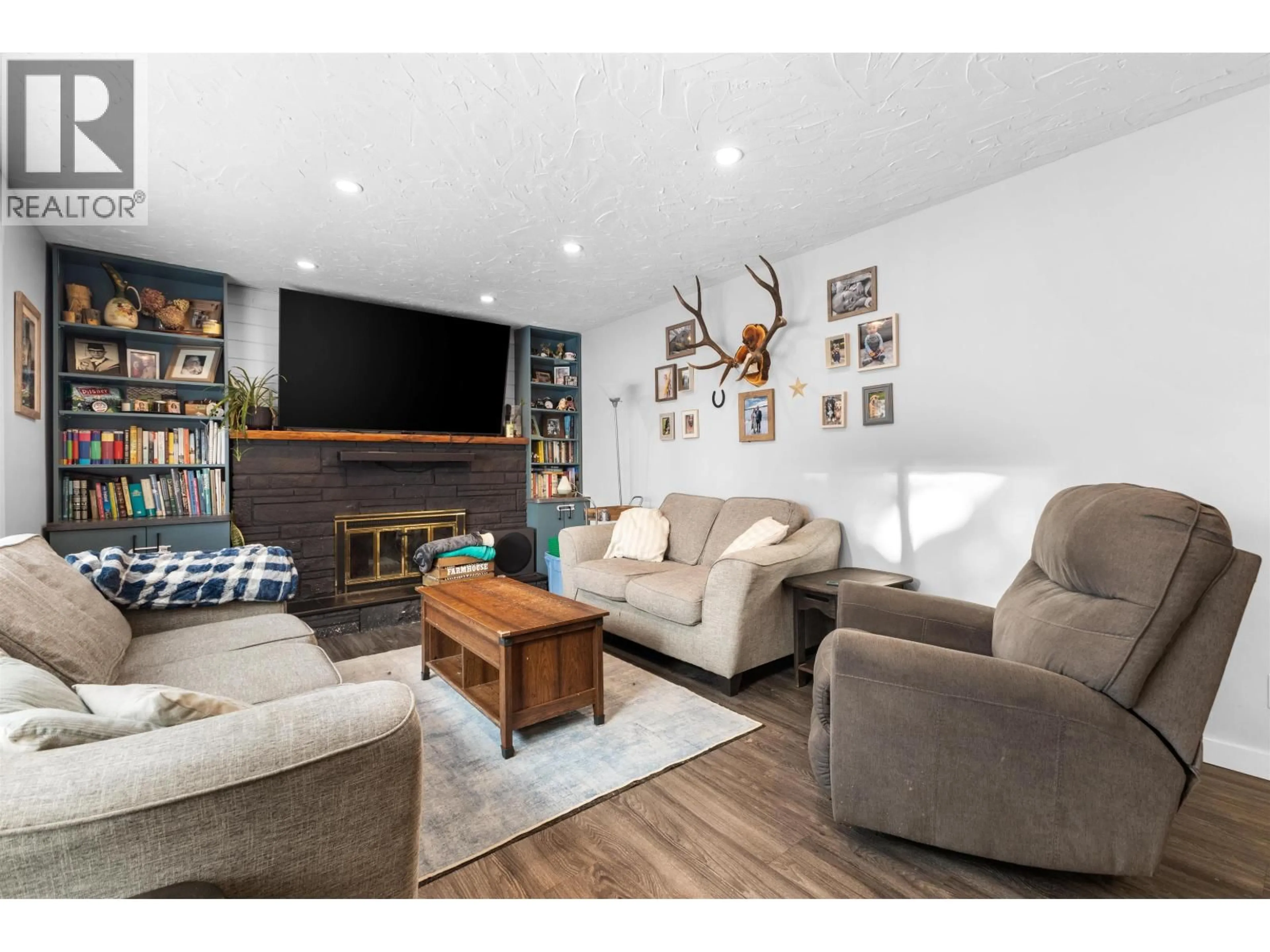 Living room with furniture, wood/laminate floor for 1570 GEDDES ROAD, Prince George British Columbia V2K5G3