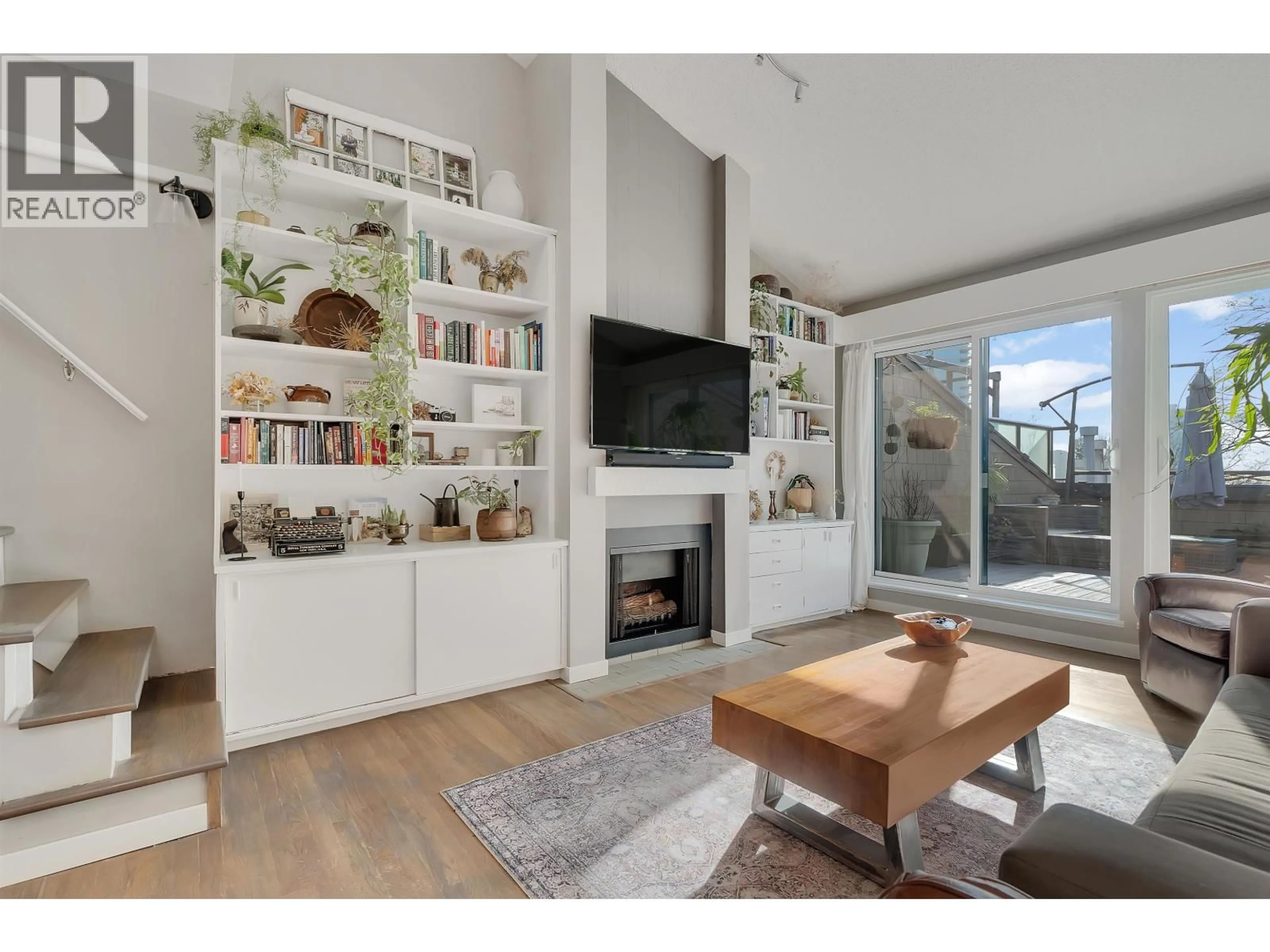 Living room with furniture, wood/laminate floor for 332 - 7055 WILMA STREET, Burnaby British Columbia V5E4B1