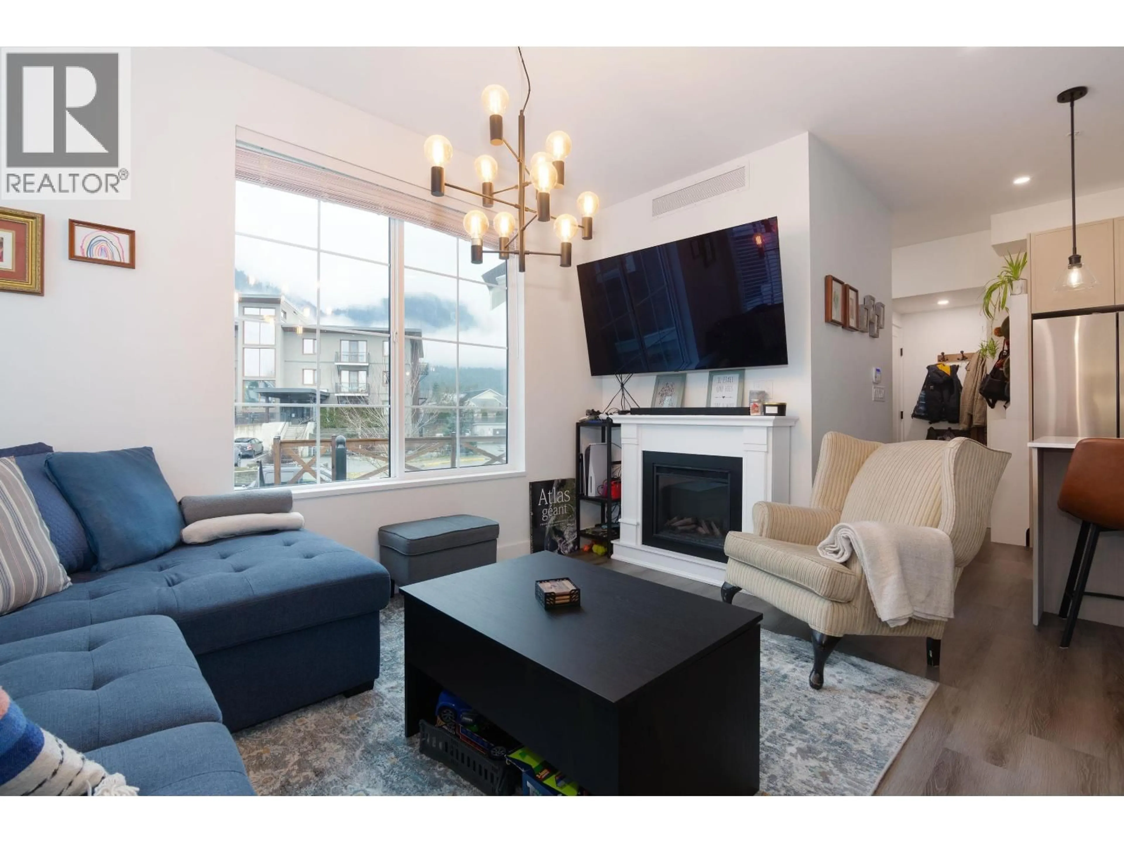 Living room with furniture, wood/laminate floor for 11 - 7360 CRABAPPLE COURT, Pemberton British Columbia V0N2L1