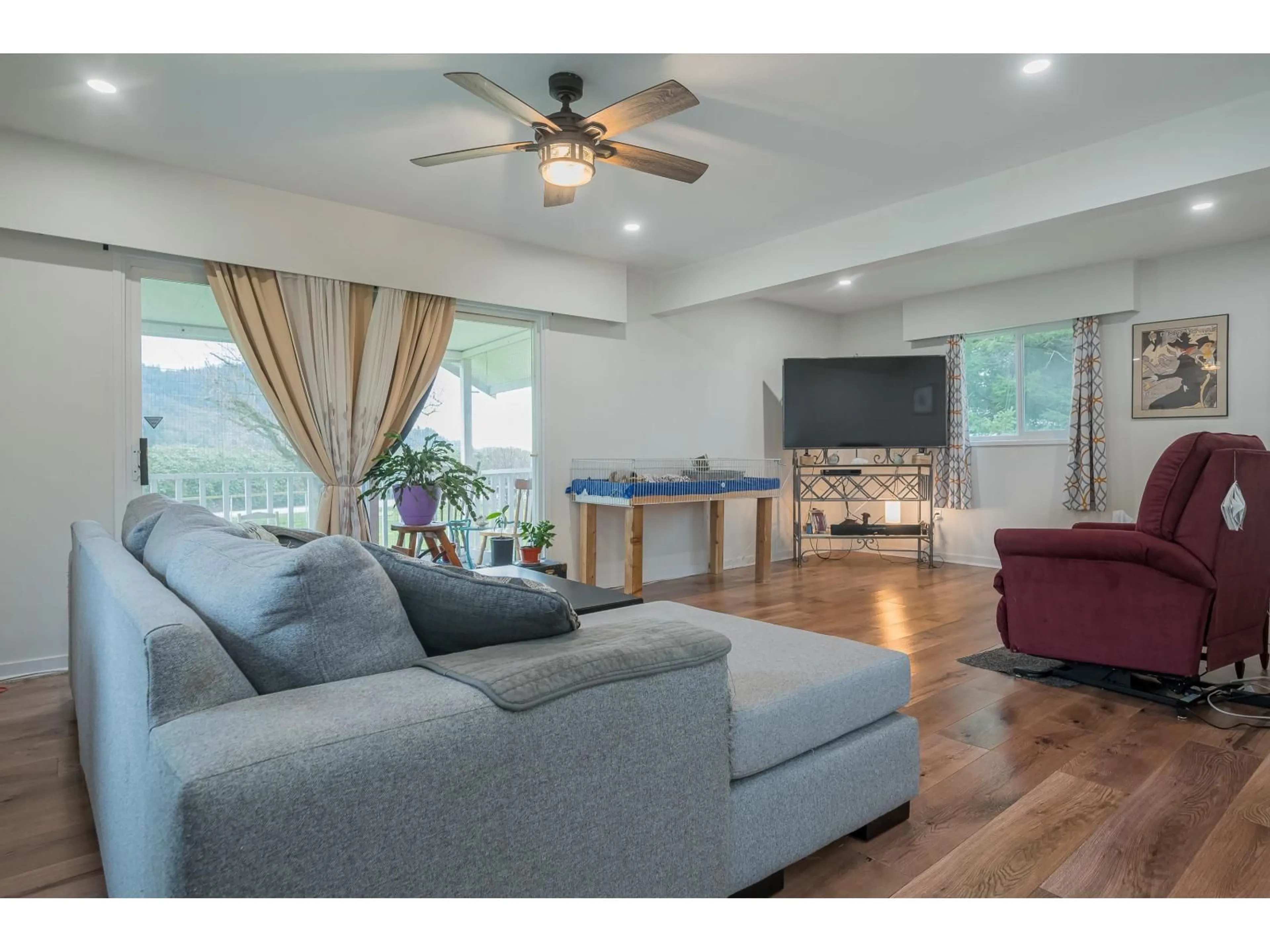 Living room with furniture, wood/laminate floor for 36113 PAGE ROAD, Abbotsford British Columbia V3G1P3