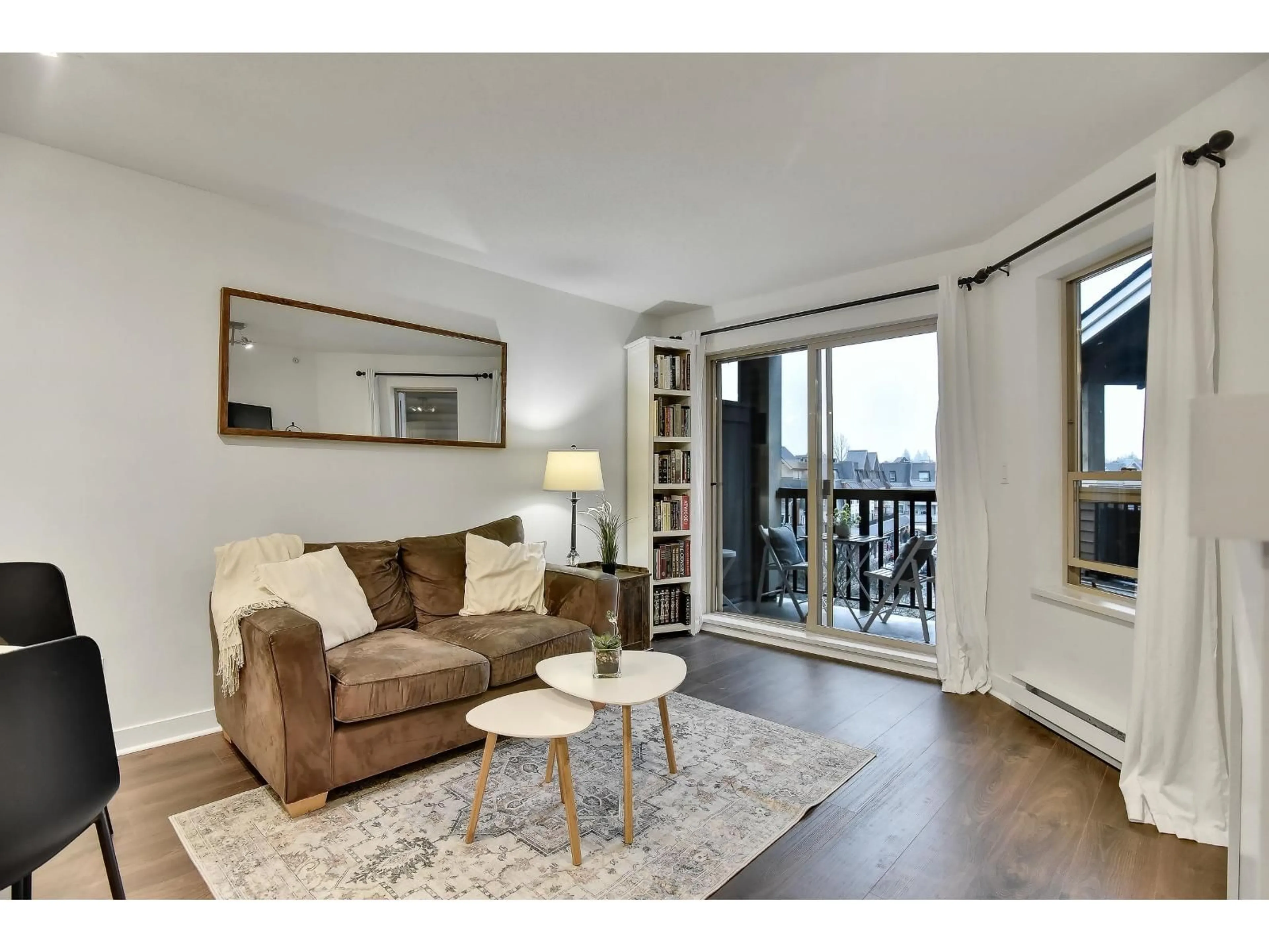 Living room with furniture, wood/laminate floor for 402 - 8915 202 STREET, Langley British Columbia V1M0B5