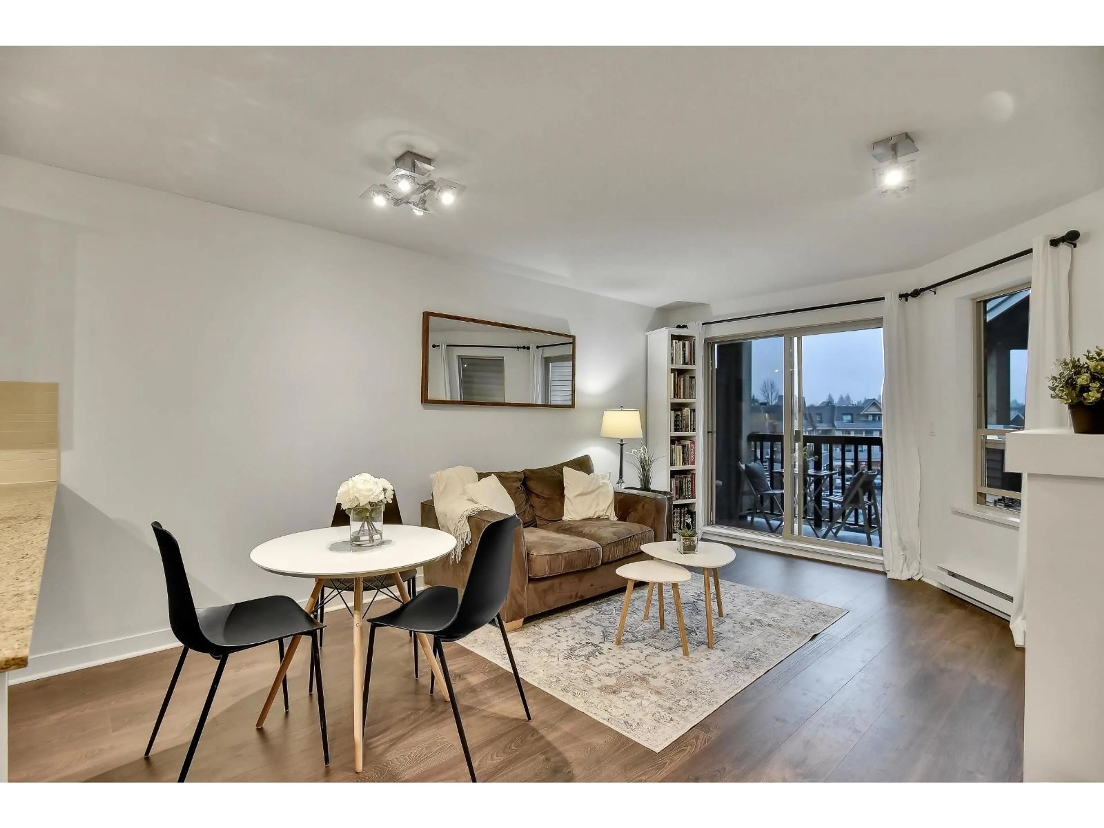 Living room with furniture, wood/laminate floor for 402 - 8915 202 STREET, Langley British Columbia V1M0B5