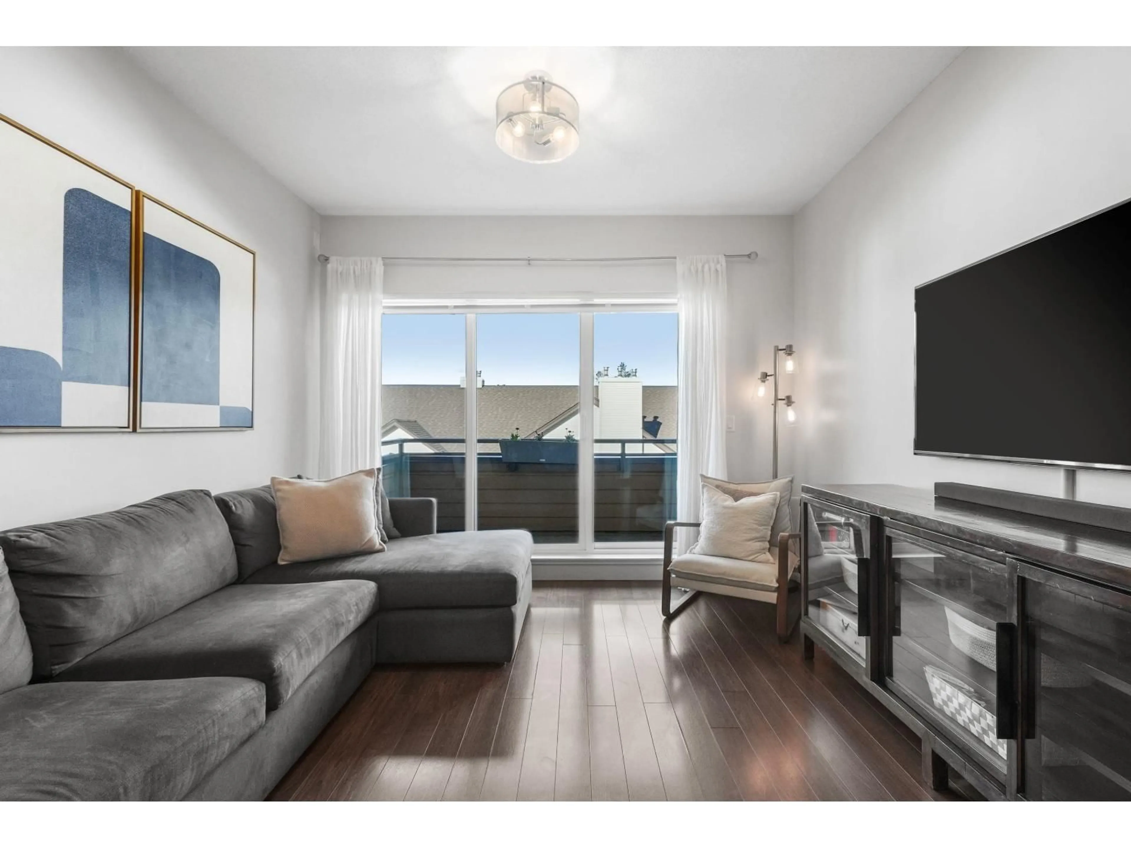 Living room with furniture, wood/laminate floor for 406 - 5811 177B STREET, Surrey British Columbia V3S4J4