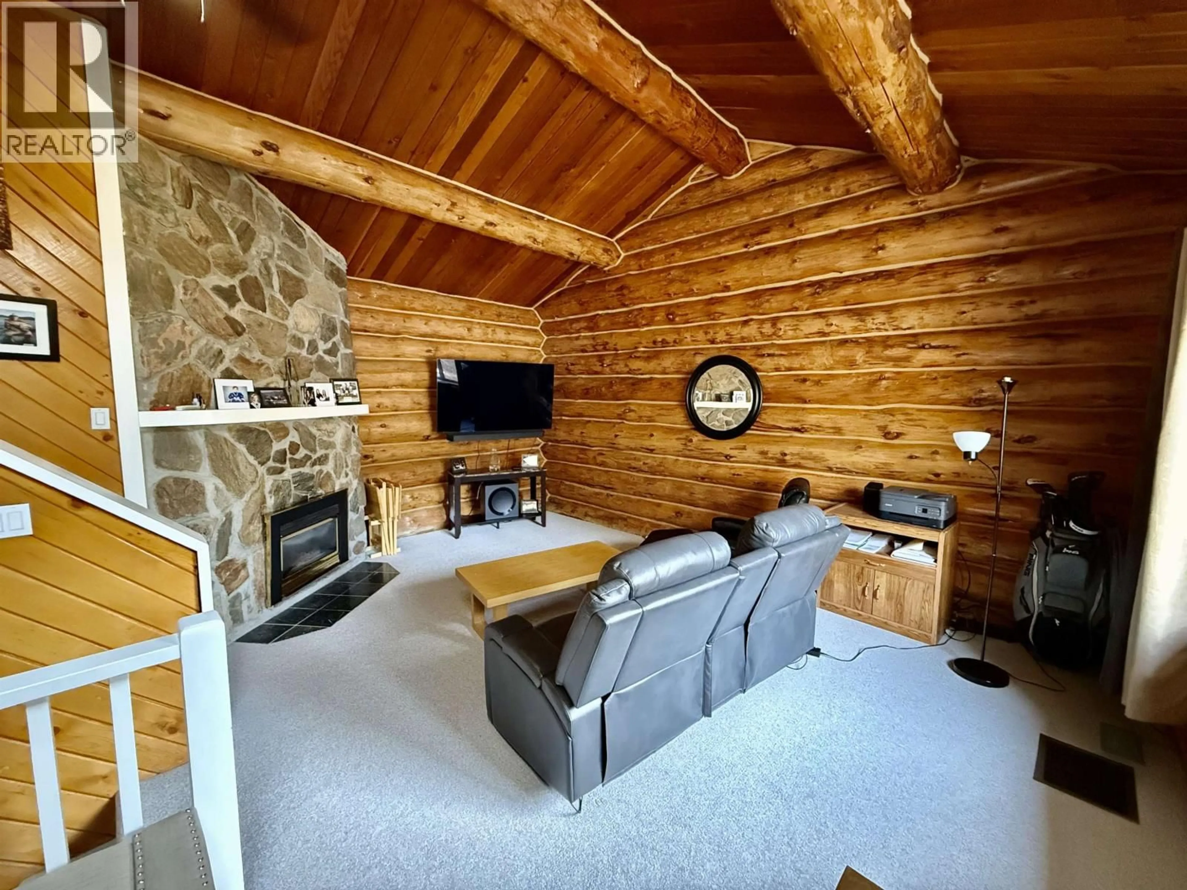 Living room with furniture, wood/laminate floor for 4895 MEESQUONO TRAIL, 108 Mile Ranch British Columbia V0K2Z0