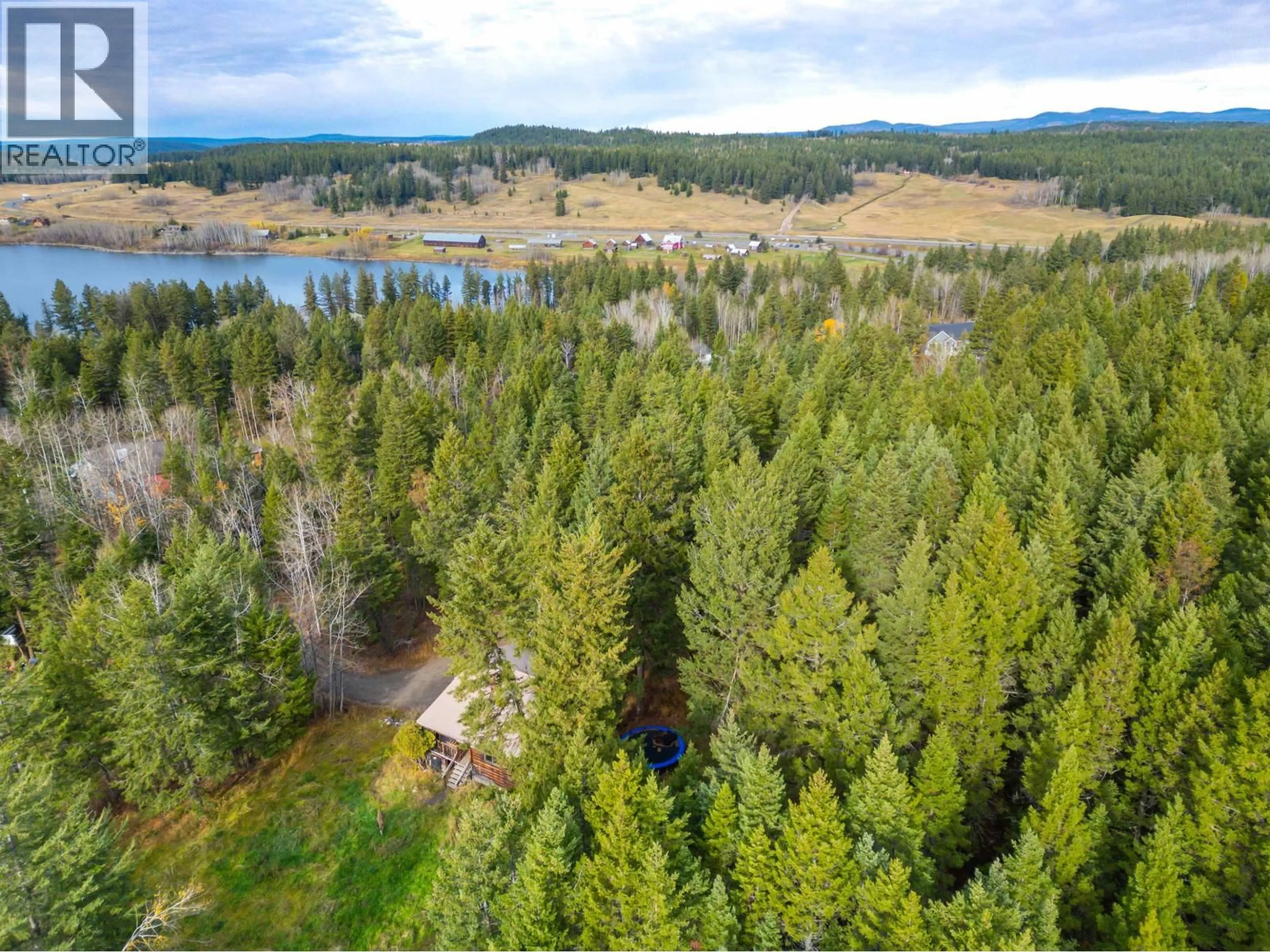 A pic from outside/outdoor area/front of a property/back of a property/a pic from drone, water/lake/river/ocean view for 4759 SUSSNEE ROAD, 108 Mile Ranch British Columbia V0K2Z0