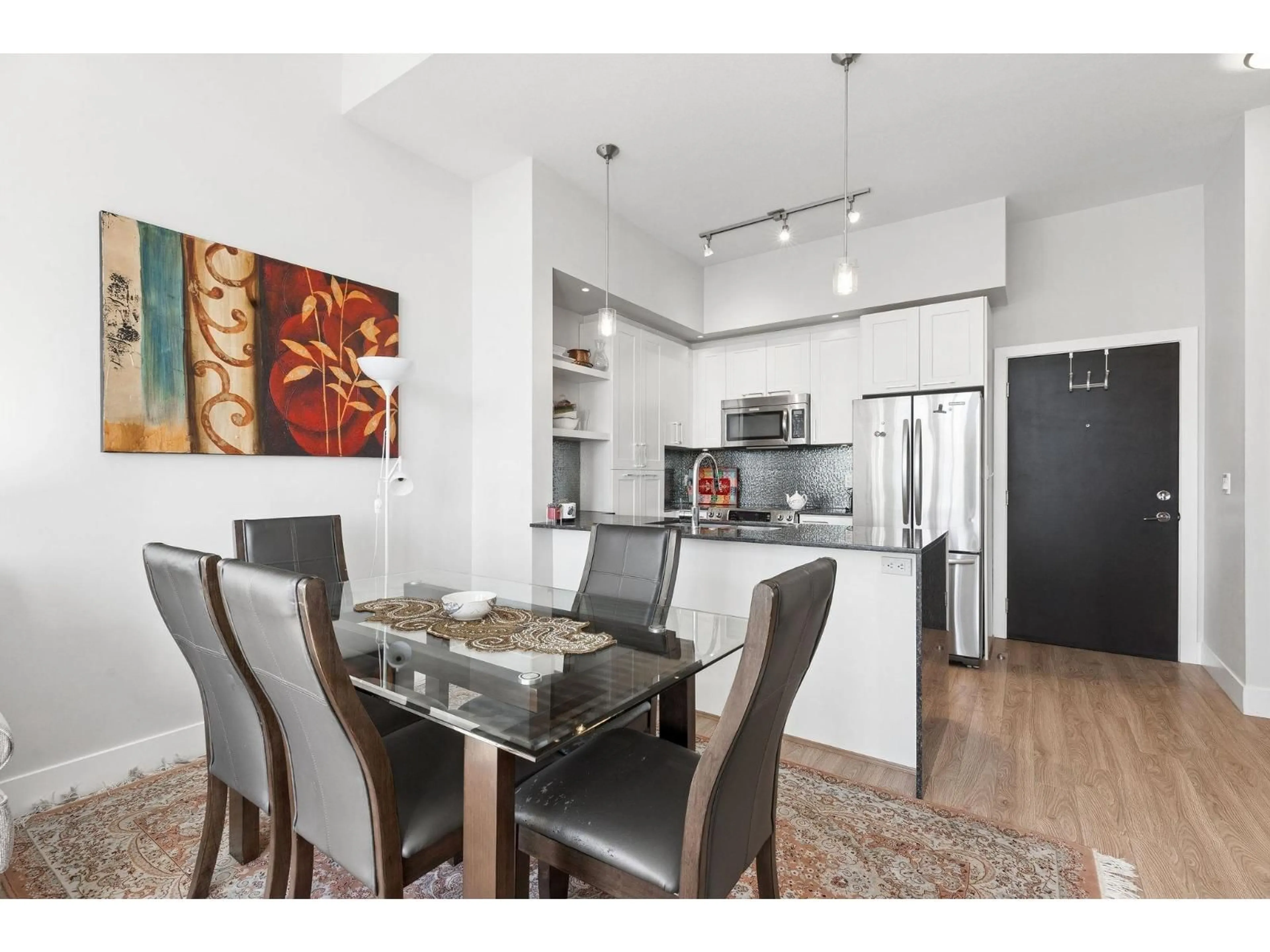 Open concept kitchen, wood/laminate floor for C419 - 20211 66TH AVENUE, Langley British Columbia V2Y0L4