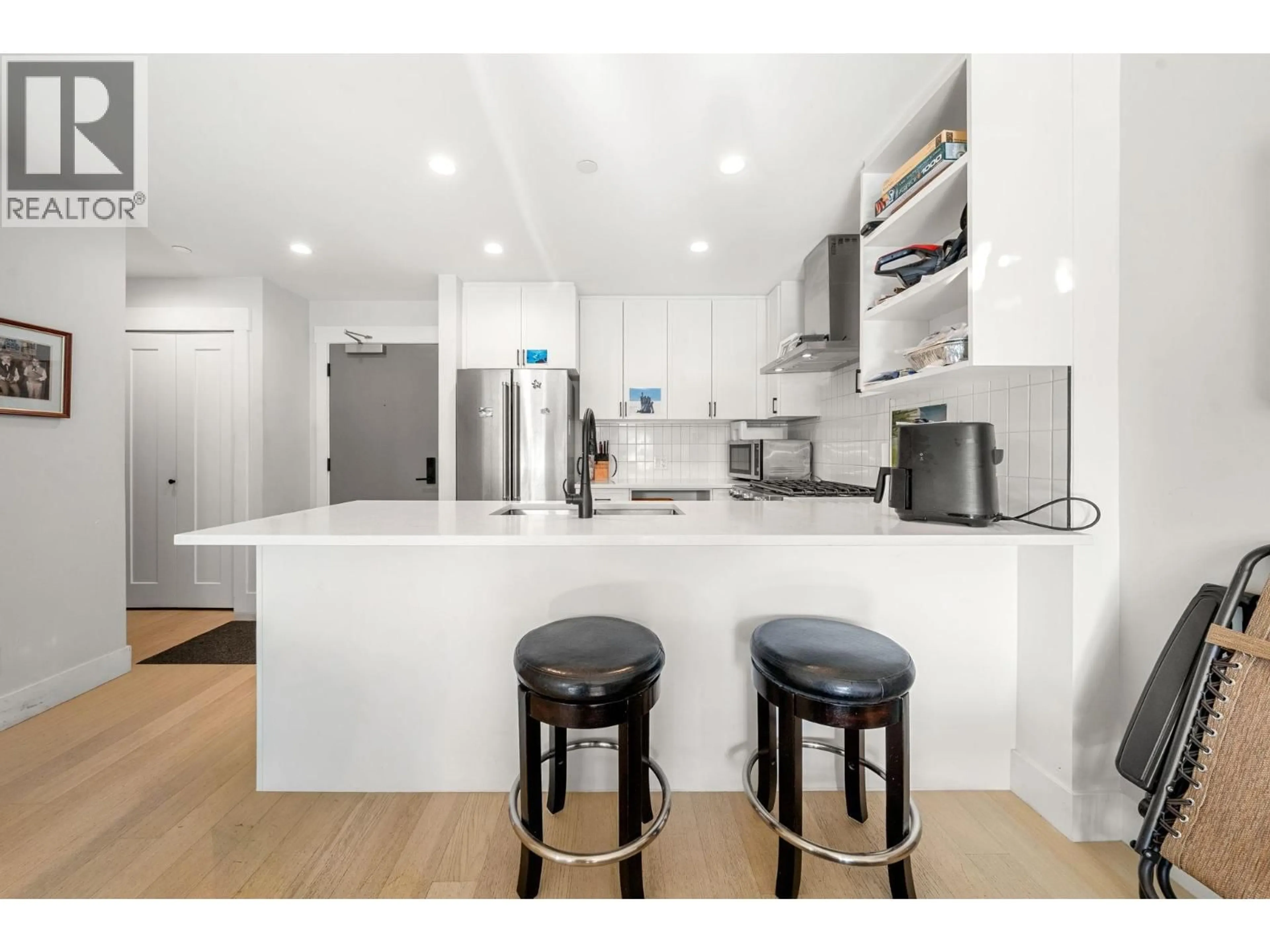 Open concept kitchen, wood/laminate floor for 308 - 22226 BROWN AVENUE, Maple Ridge British Columbia V2X4R2