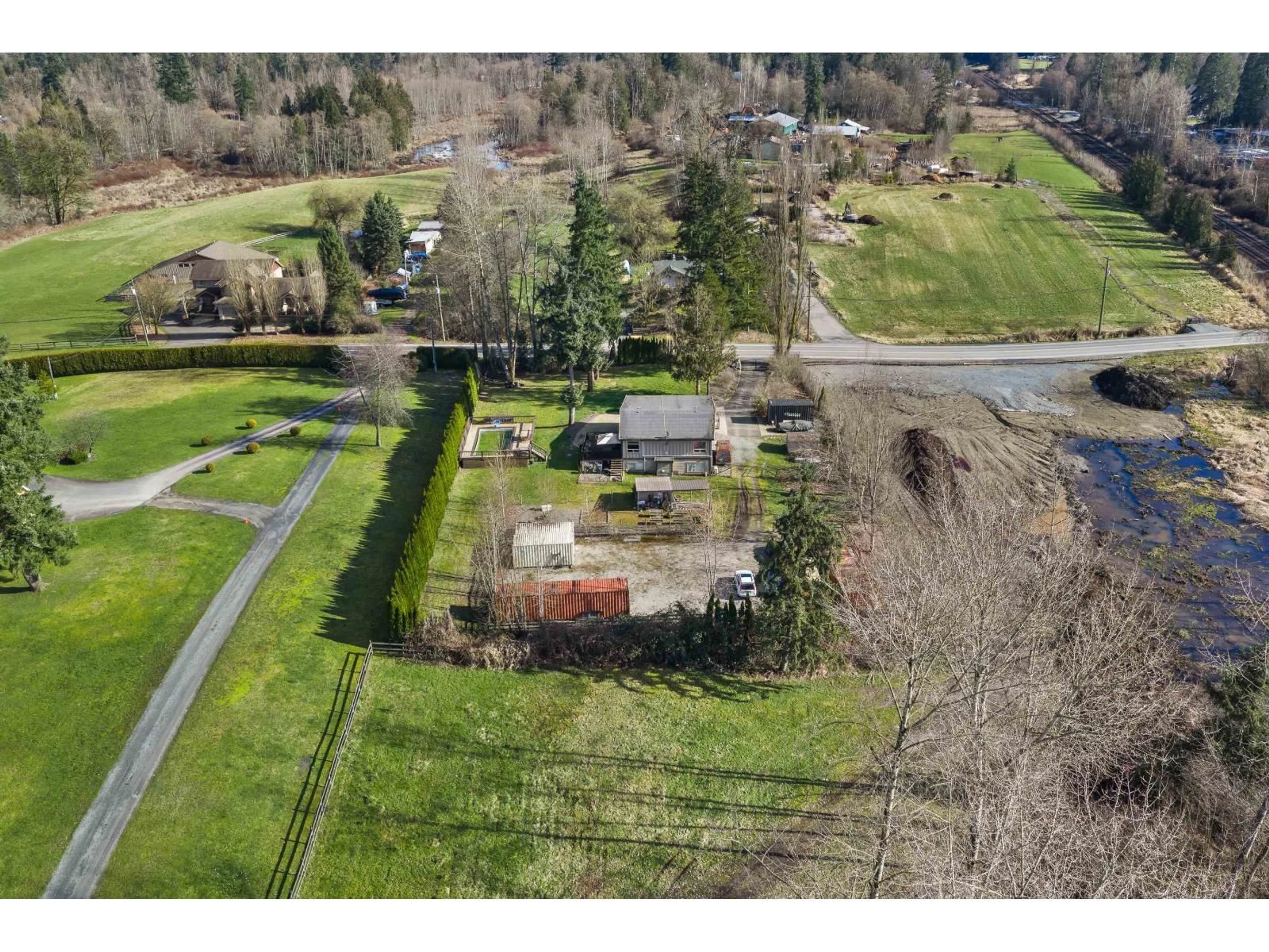 A pic from outside/outdoor area/front of a property/back of a property/a pic from drone, street for 9729 216 STREET, Langley British Columbia V1M3J1
