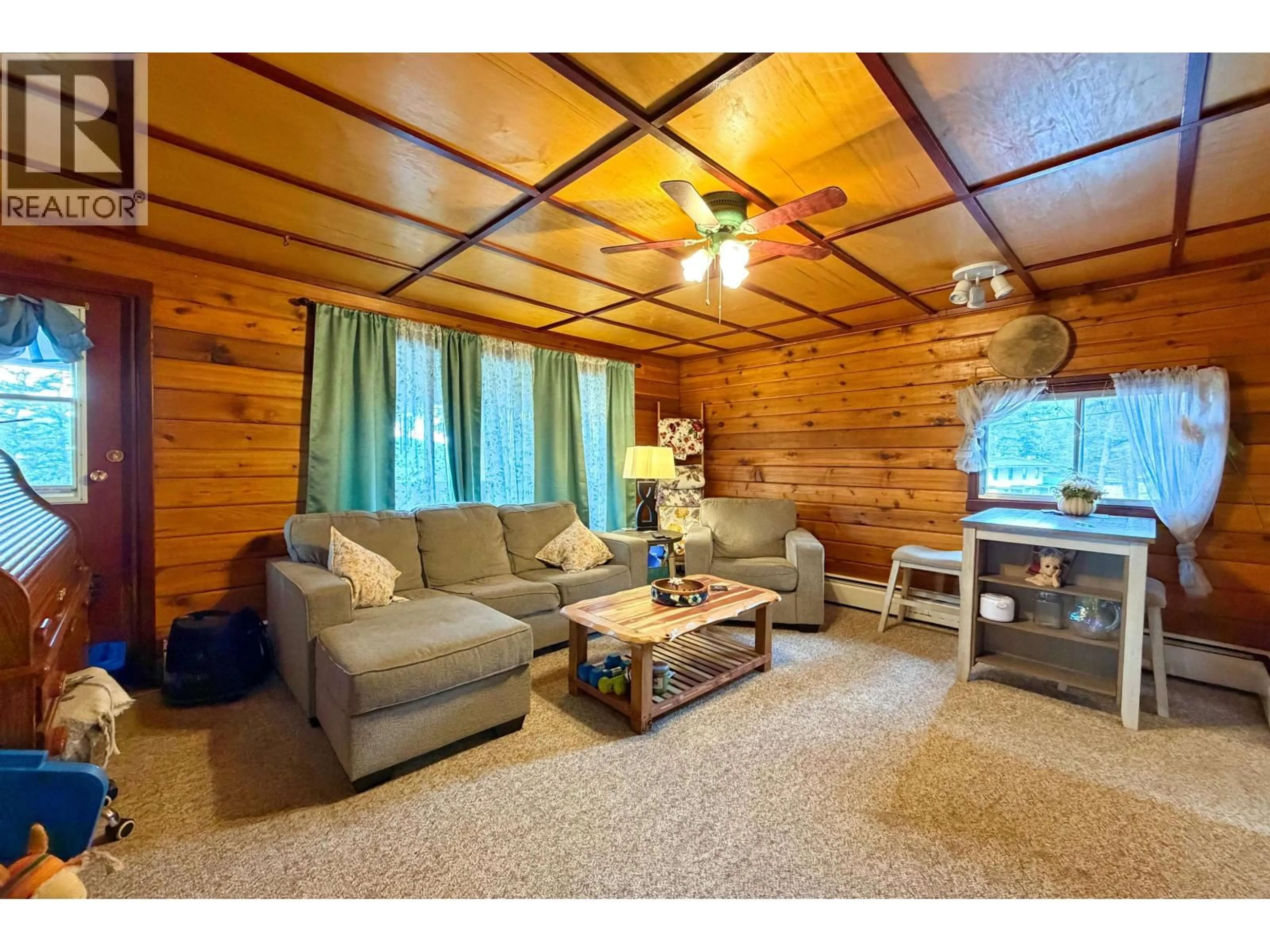 Living room with furniture, wood/laminate floor for 1009 HUBBLE ROAD, Williams Lake British Columbia V2G2Z9