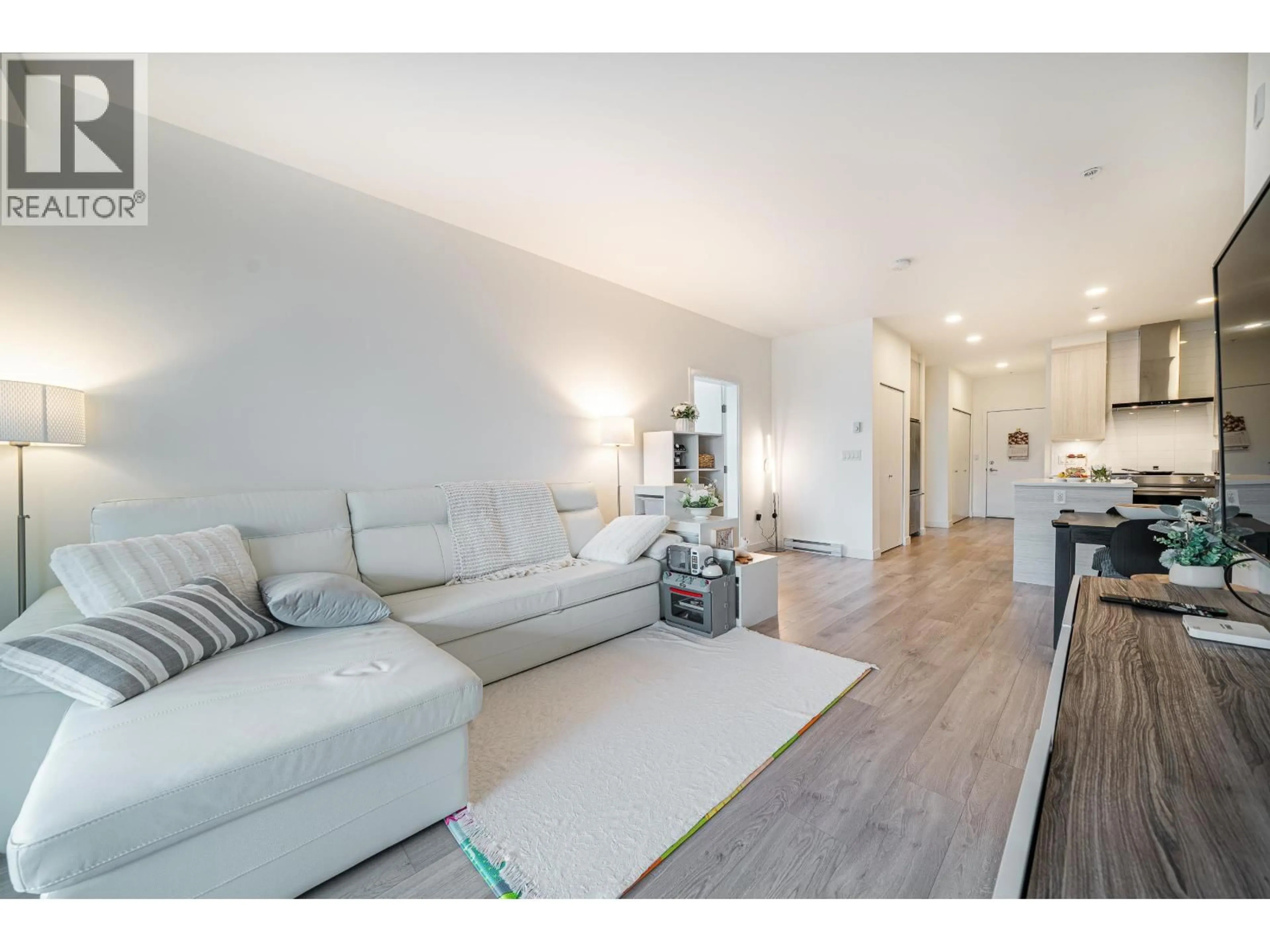 Living room with furniture, wood/laminate floor for 404 - 7169 14TH AVENUE, Burnaby British Columbia V3N0H6