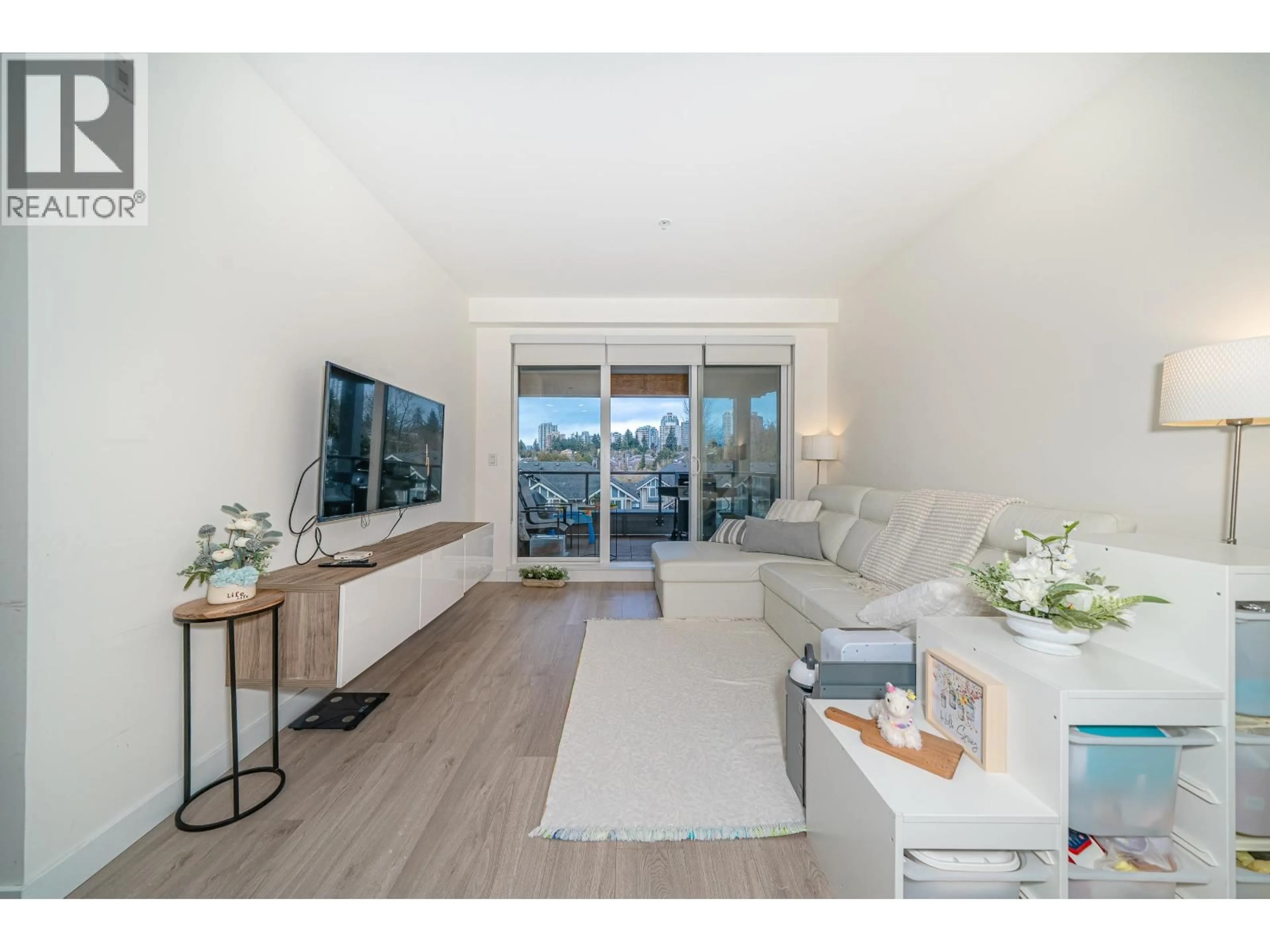 Living room with furniture, wood/laminate floor for 404 - 7169 14TH AVENUE, Burnaby British Columbia V3N0H6