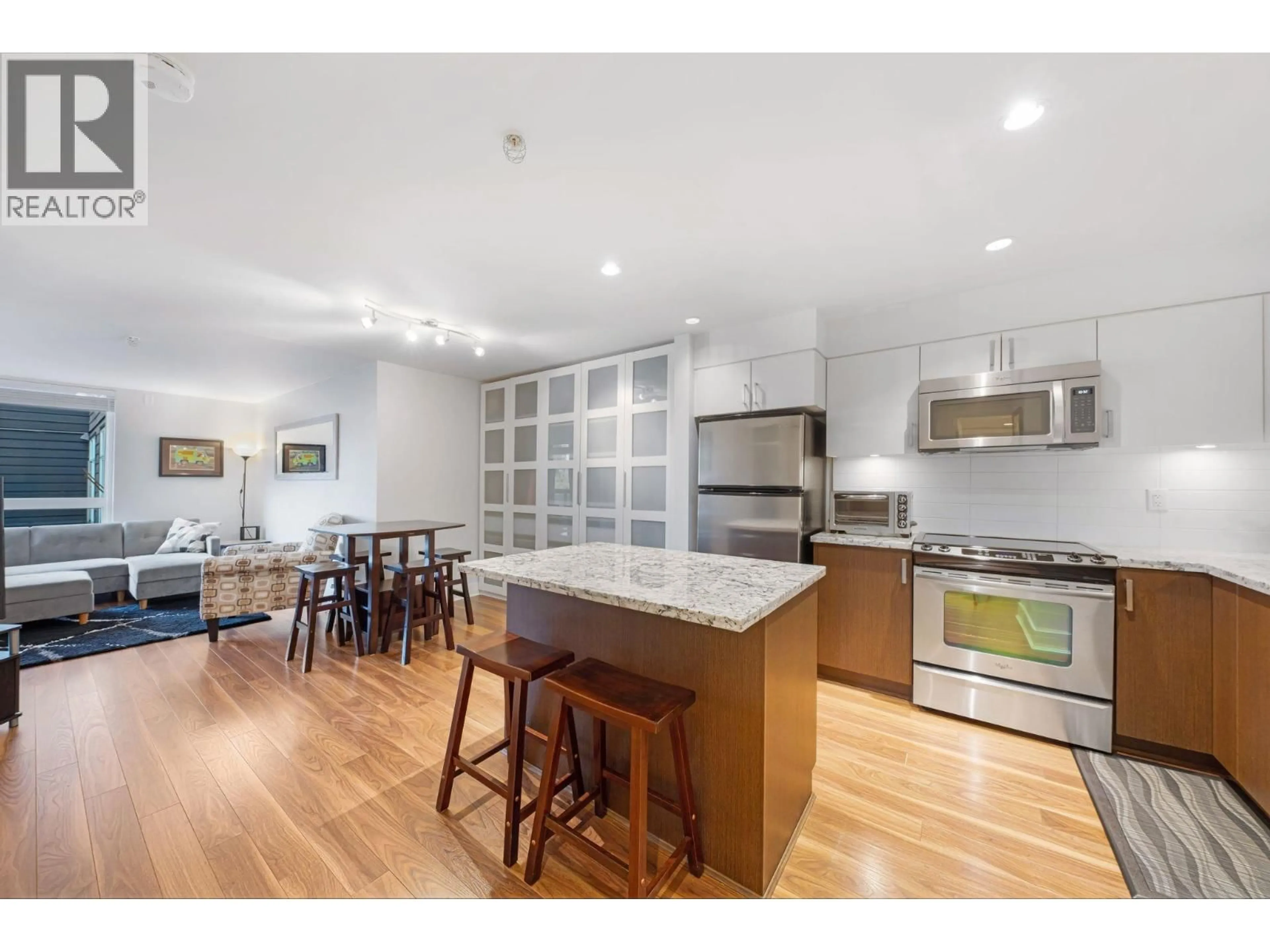 Open concept kitchen, wood/laminate floor for 213 - 85 EIGHTH AVENUE, New Westminster British Columbia V3L0E9