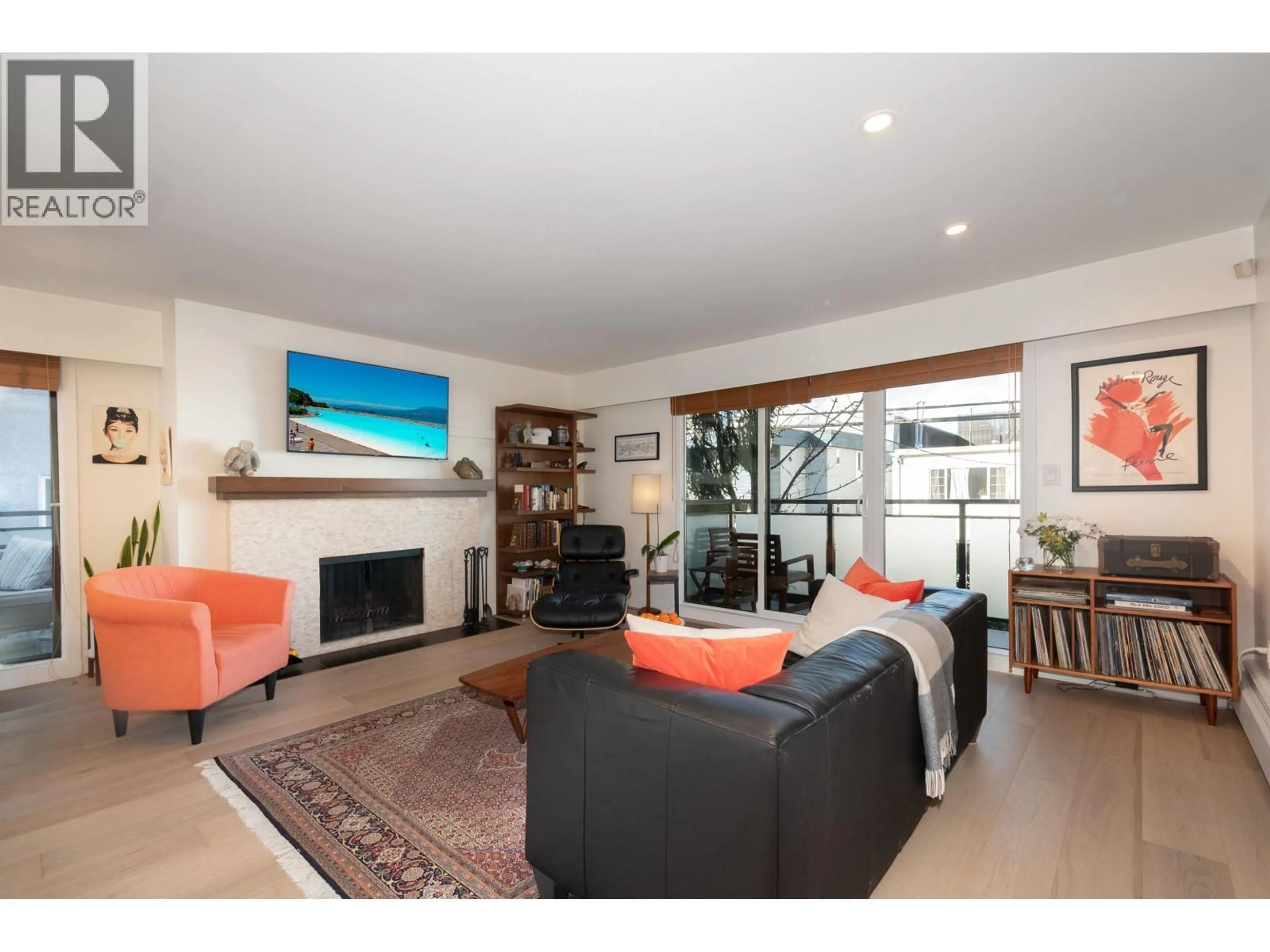 Living room with furniture, wood/laminate floor for 212 - 2255 YORK AVENUE, Vancouver British Columbia V6K1C5