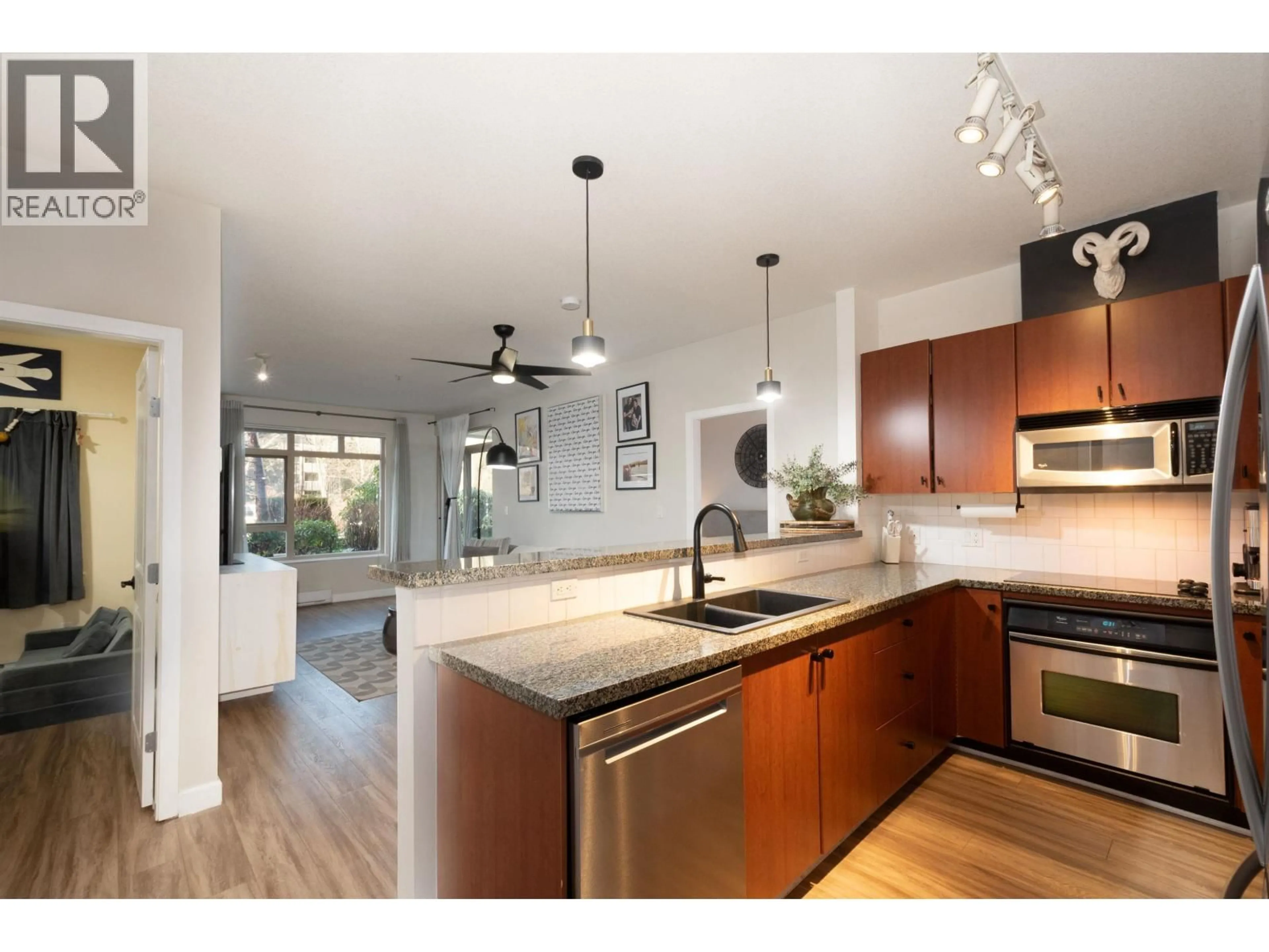 Open concept kitchen, wood/laminate floor for 121 - 100 CAPILANO ROAD, Port Moody British Columbia V3H5M9